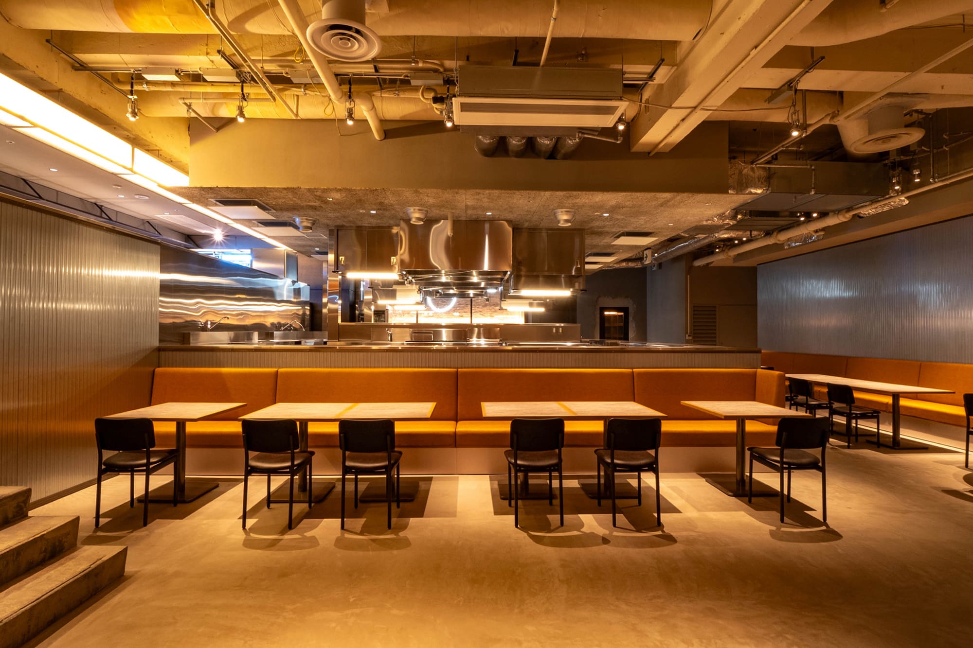 Restaurant interior with open kitchen