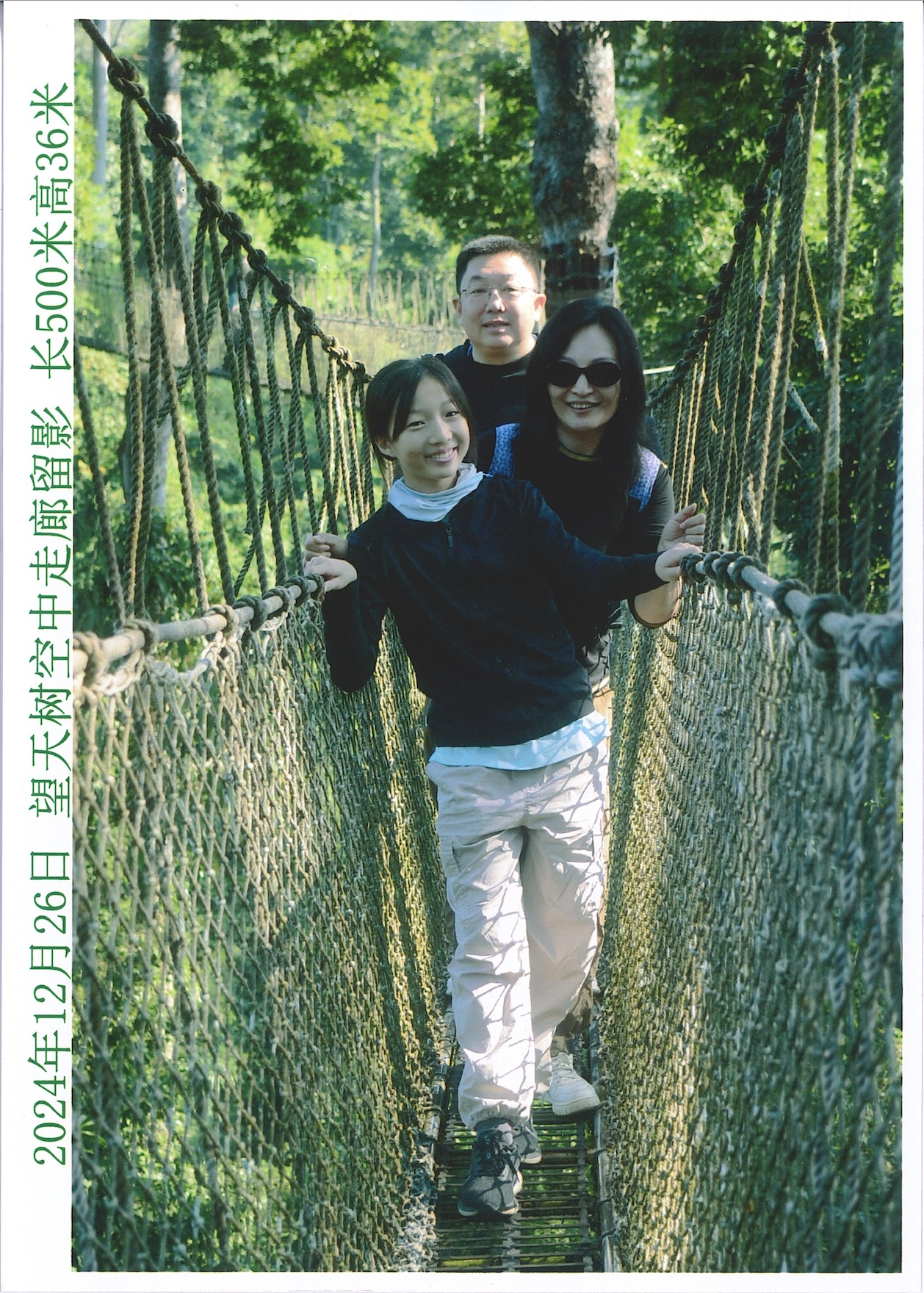 Family enjoying nature on a suspension bridge