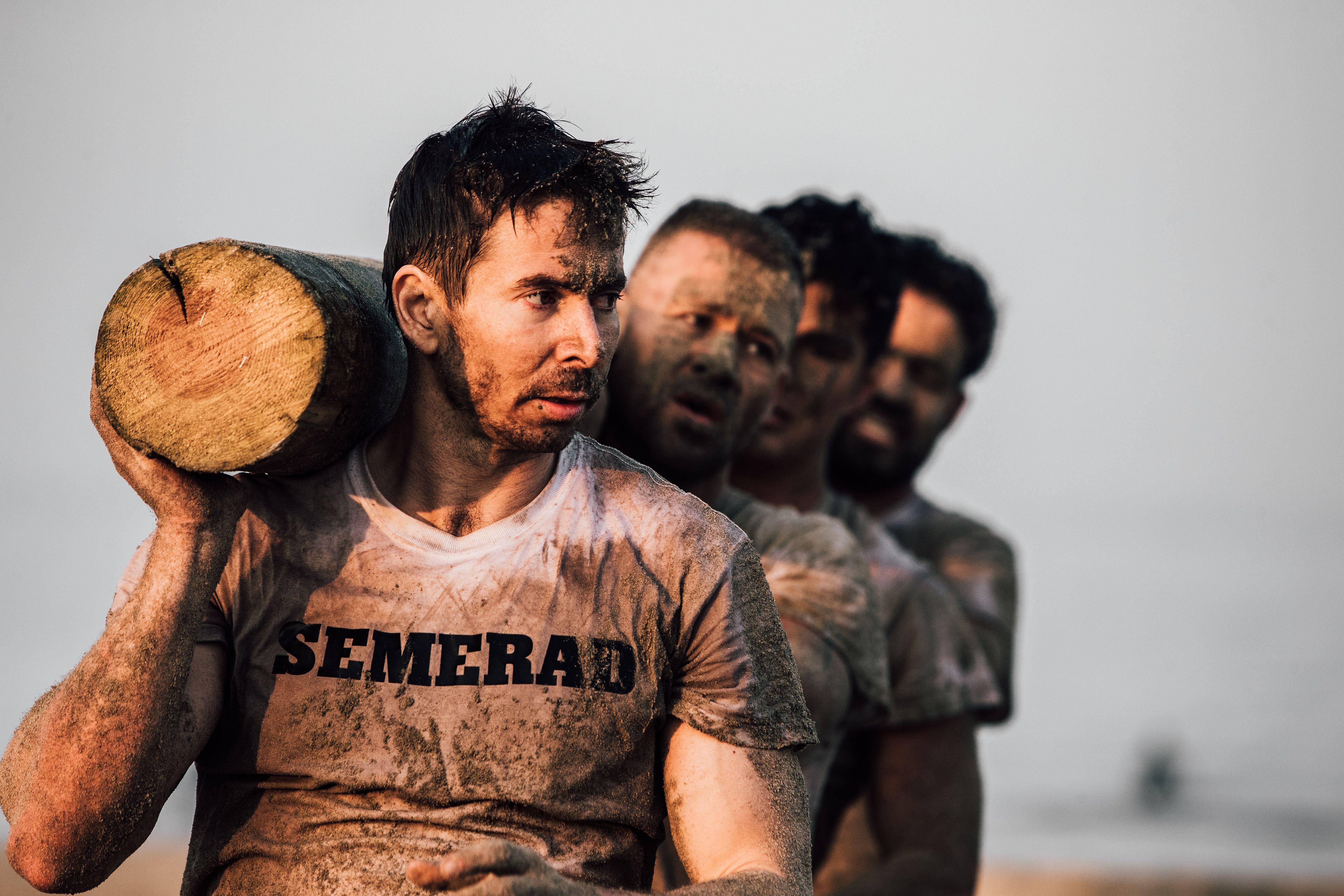 David carrying a log during endurance training