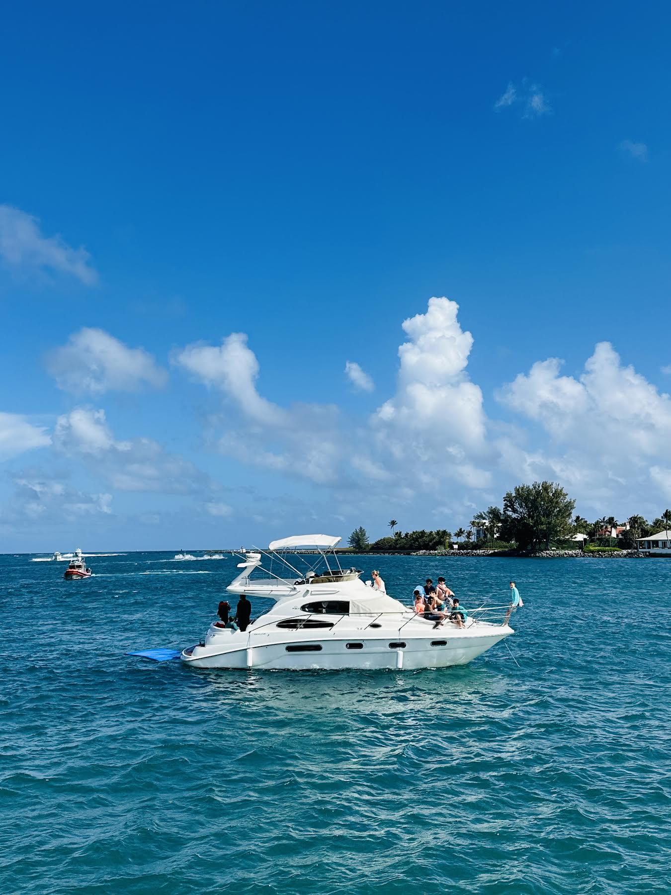 Sealine F37 anchored near Peanut Island with guests