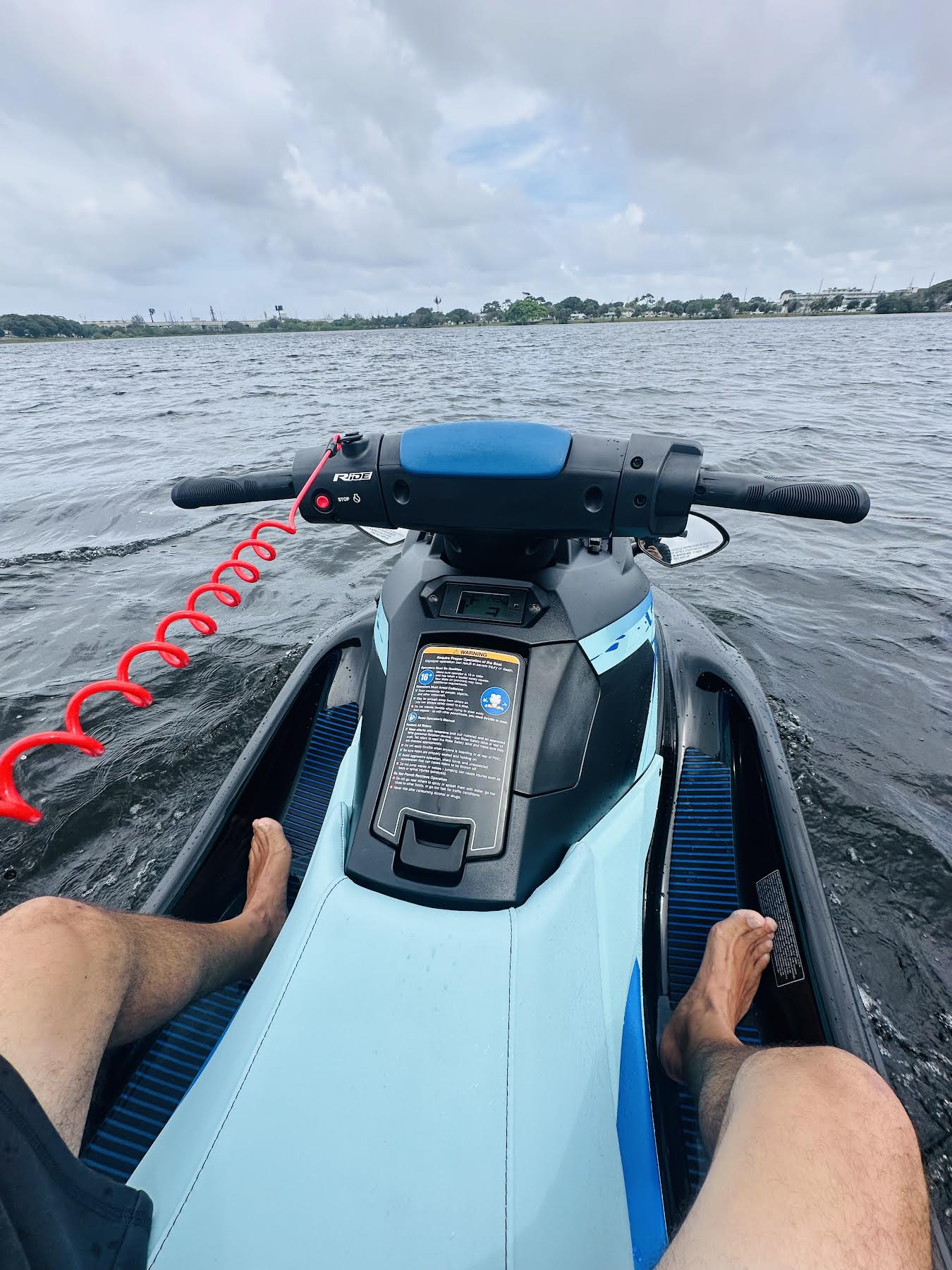 POV rider view from Yamaha WaveRunner showing handlebars and open water