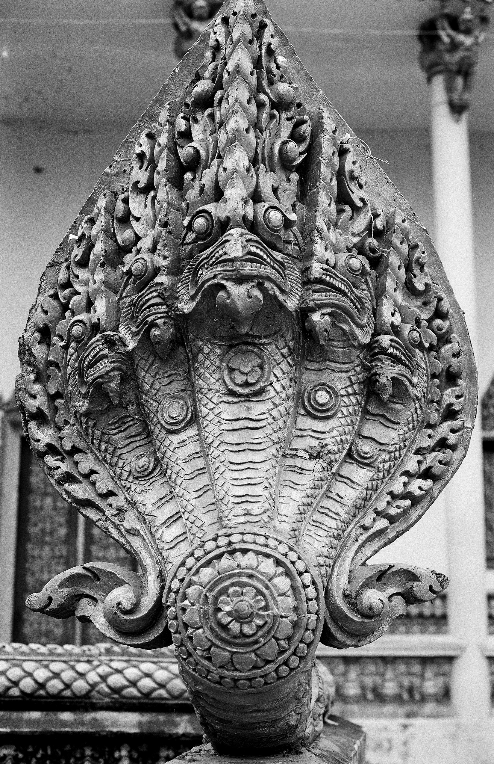 Ornate carved elephant head finial sculpture with detailed trunk and decorative patterns