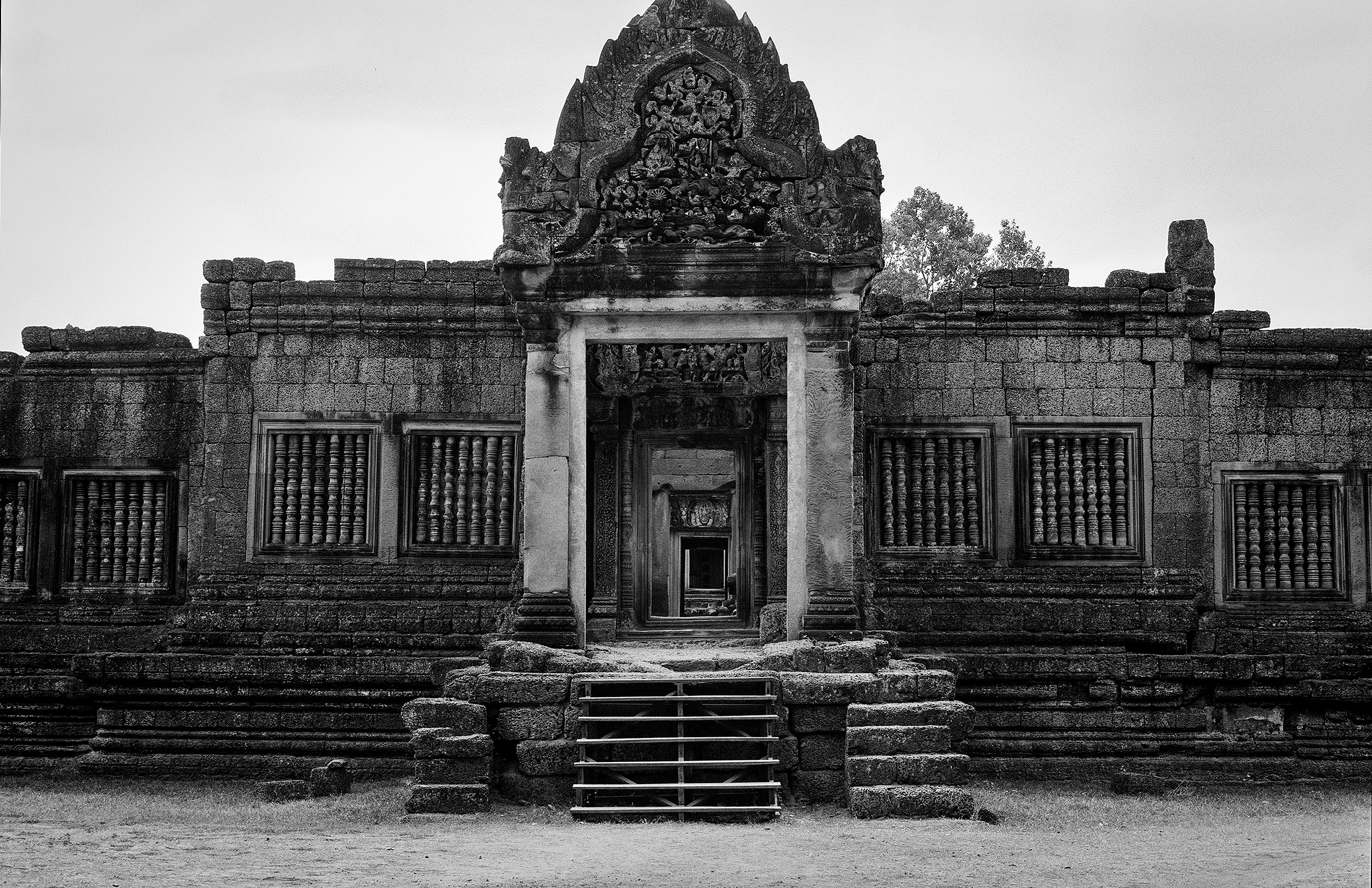 Angkor Wat sanctuary building with relief carvings ornate windows and stepped pyramid roofs