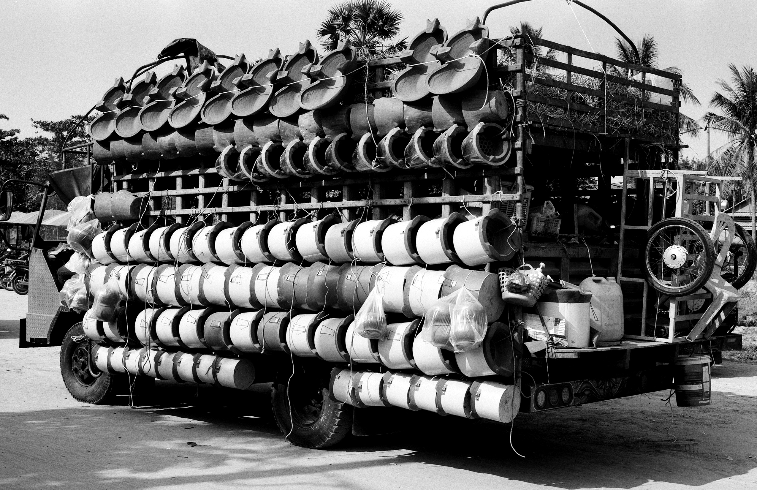 Truck loaded with hundreds of ceramic clay water vessels and fishing traps
