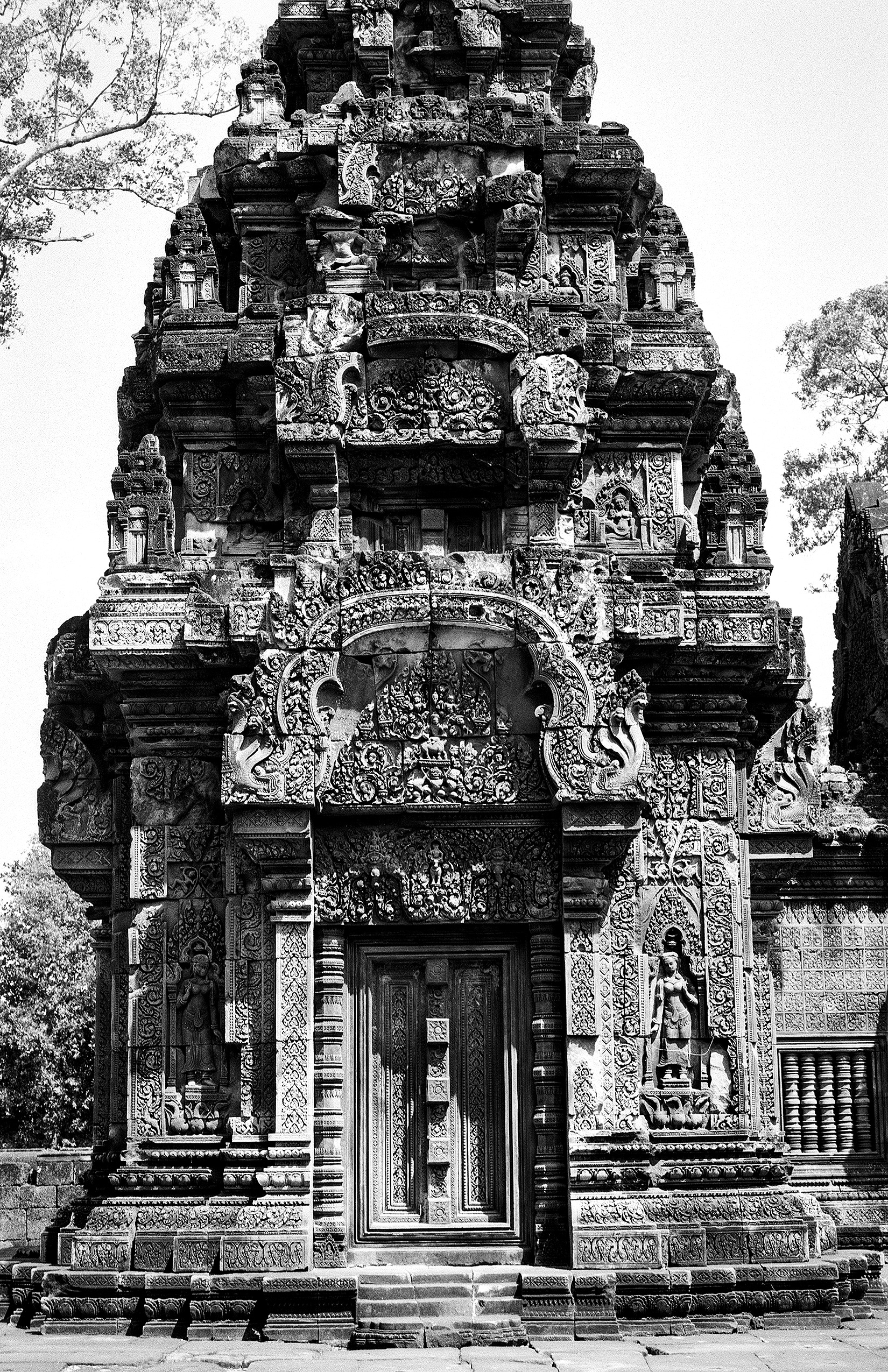 Intricate carved temple tower with elaborate stone religious iconography