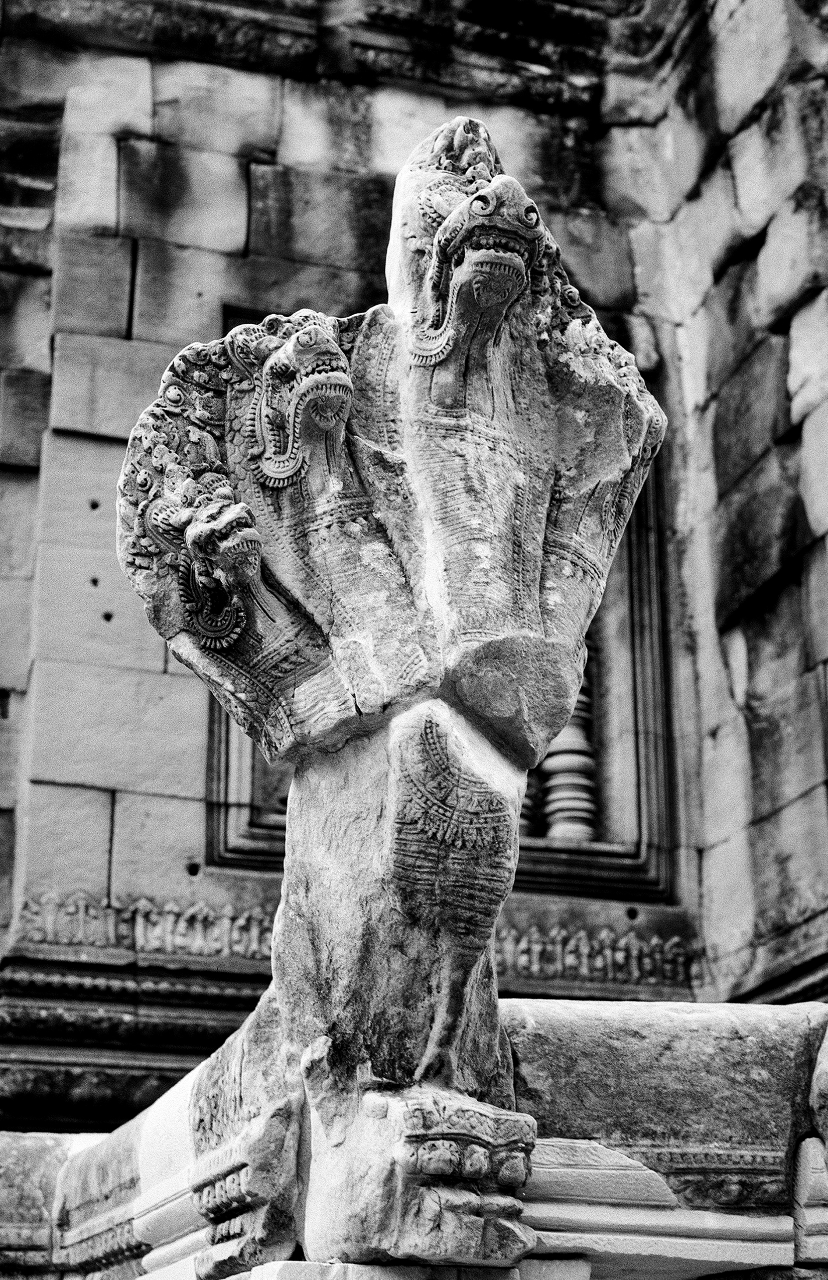 Ornate carved stone elephant sculpture with intricate temple relief detail