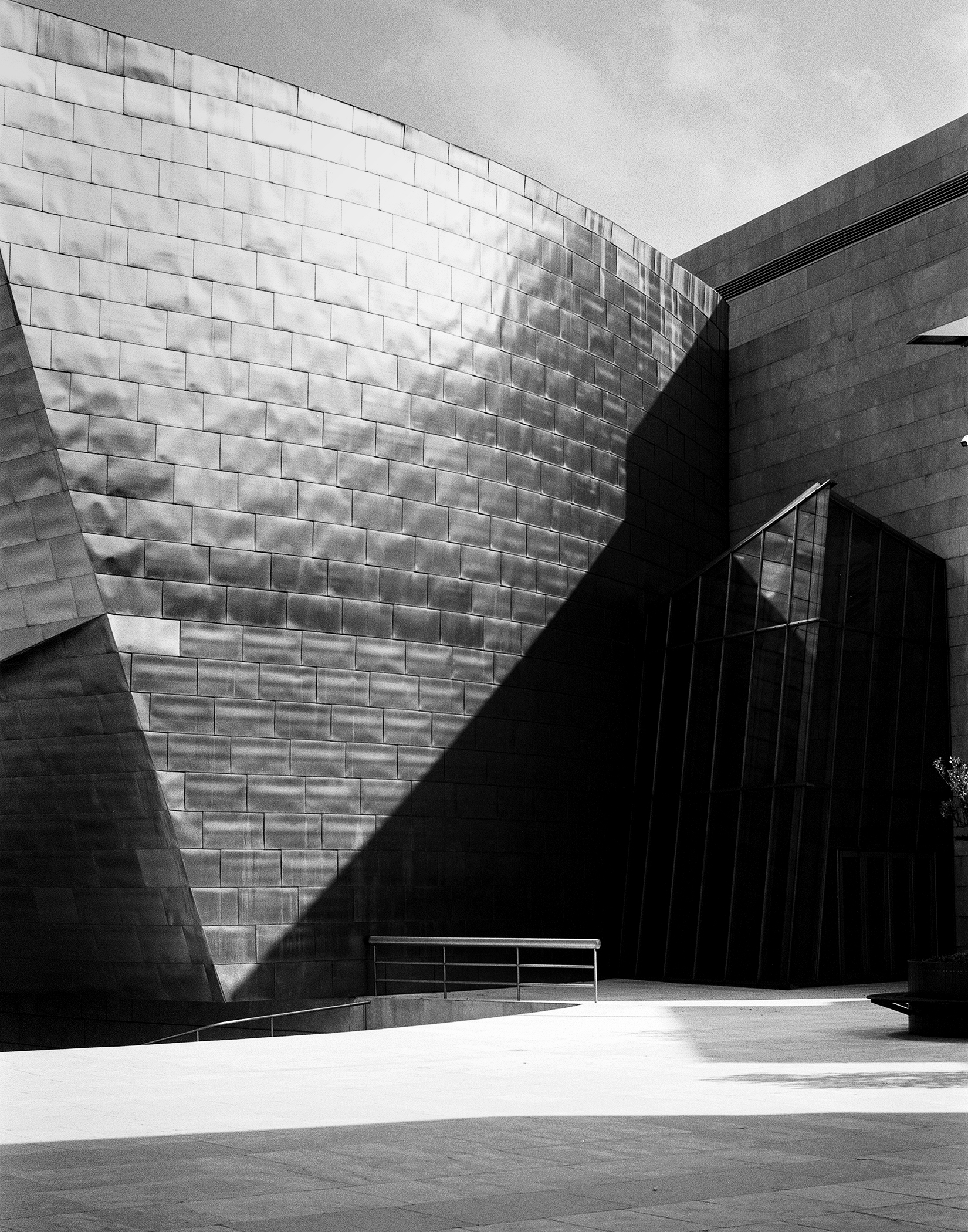 Gothic cathedral colonnade with dramatic light and shadows