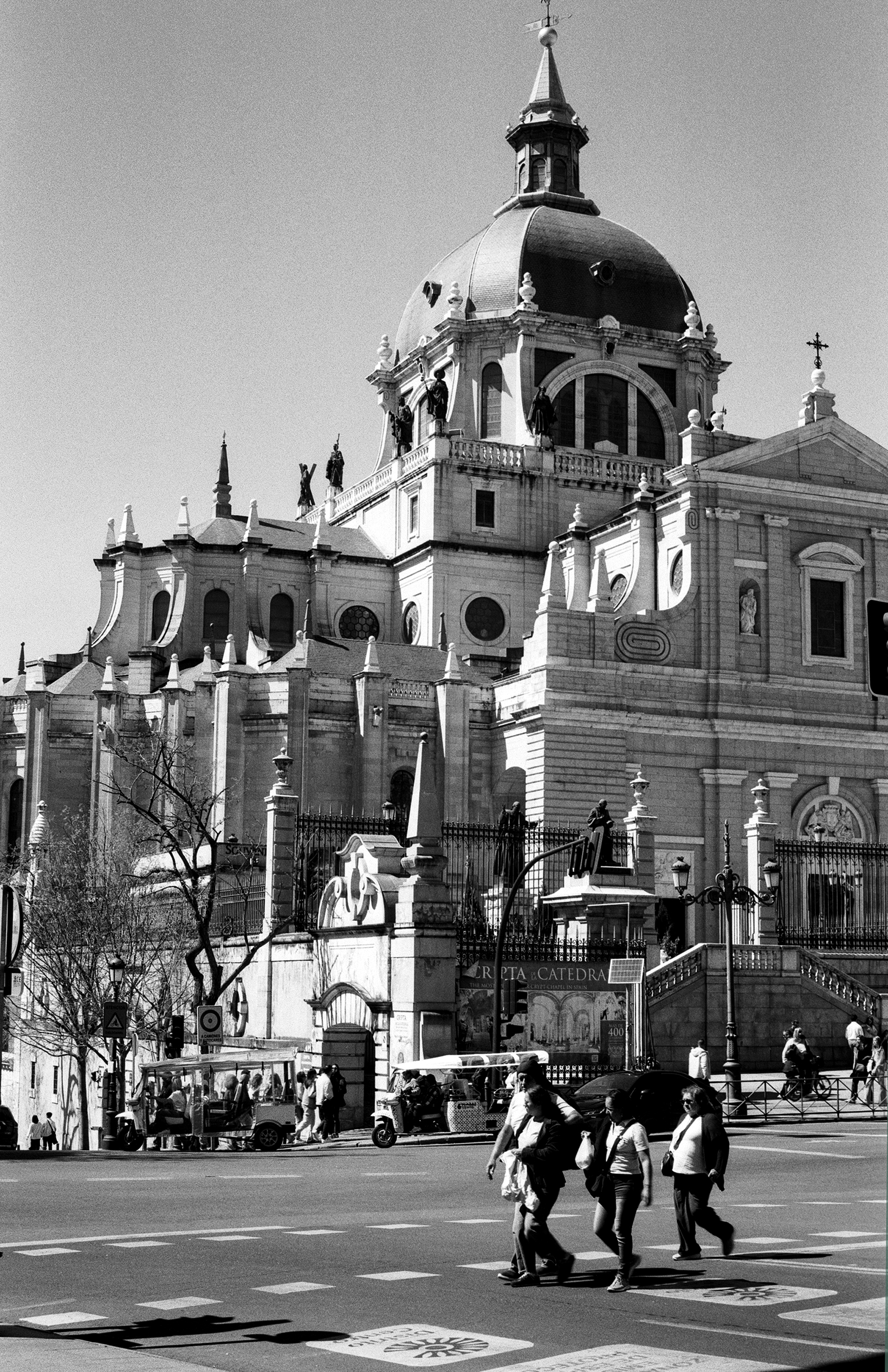 Cathedral dome with baroque architectural details and sculptural elements against sky