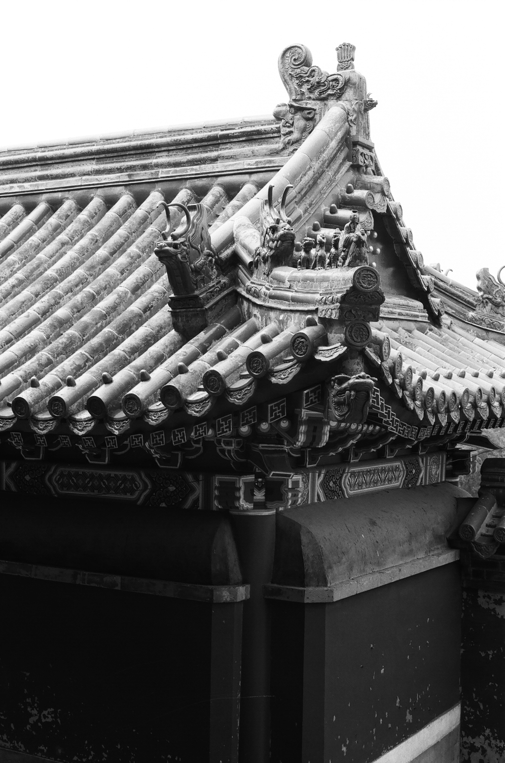 Traditional Chinese temple roof detail with ornate tiles and dragon decorations