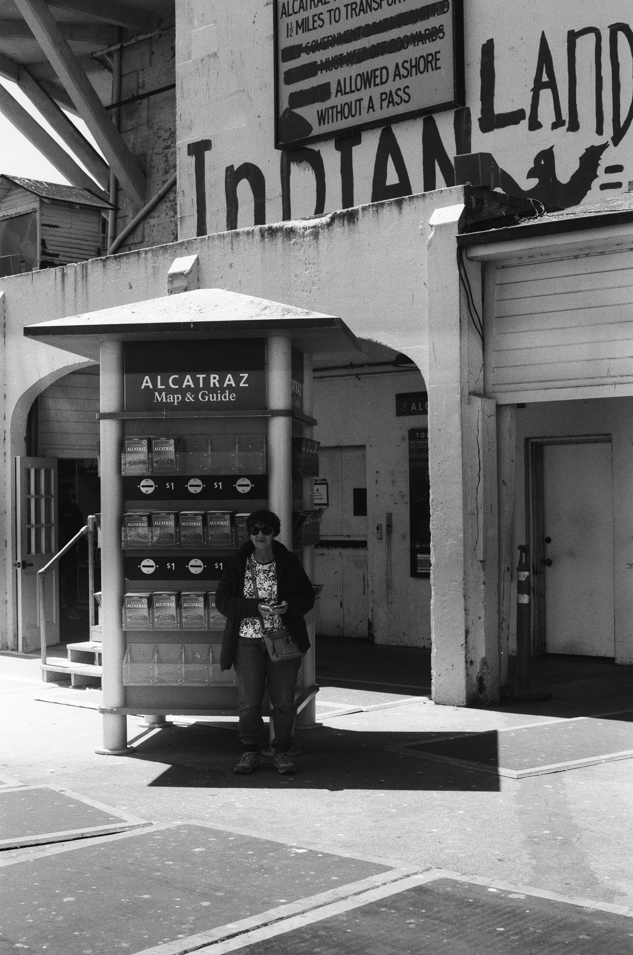 Alcatraz Island tourist center with Indian Land sign and person at kiosk entrance