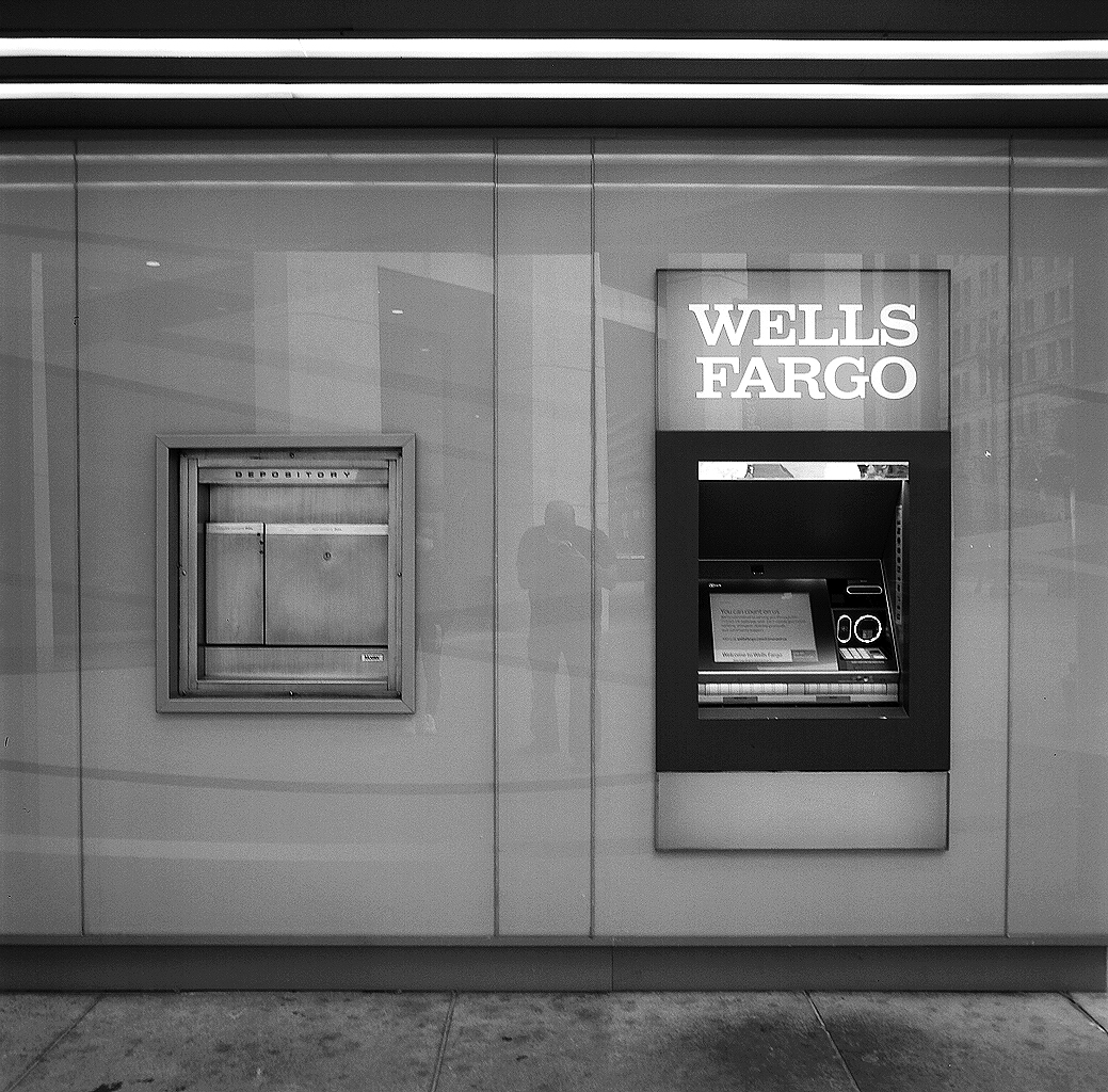 Wells Fargo bank storefront with ATM and mailbox slots in minimalist modern institutional facade