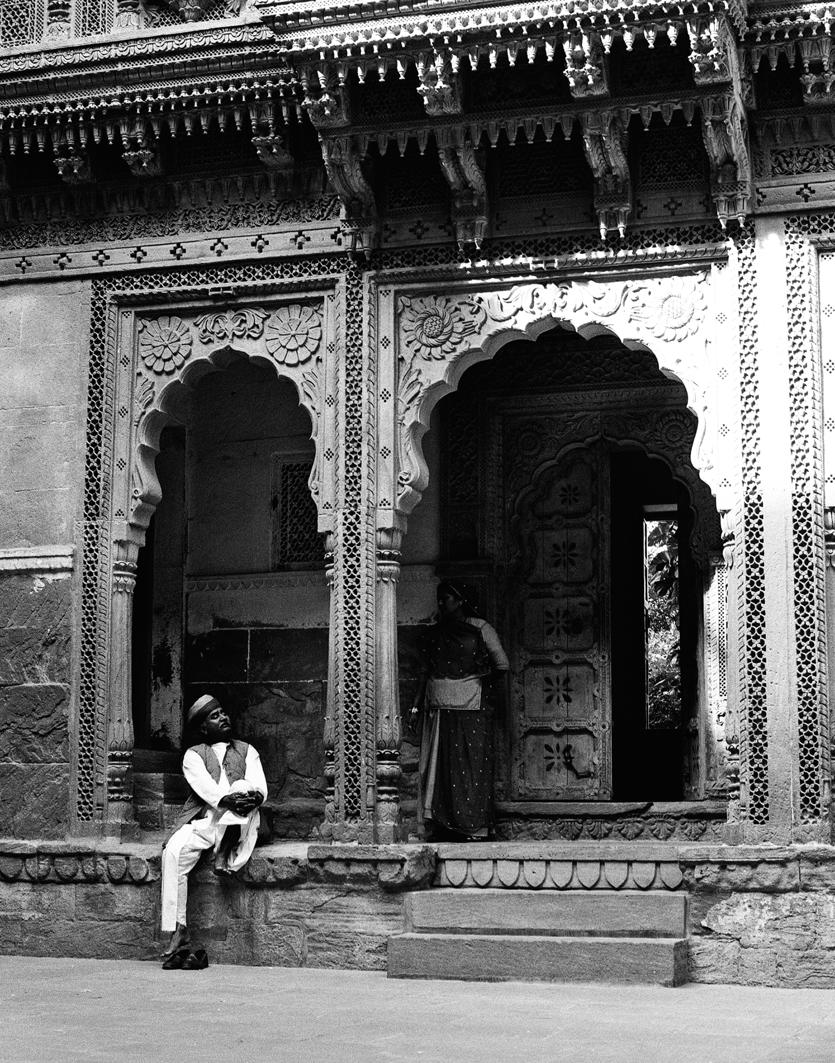 Traditional musician playing ravanhatta sitting cross-legged