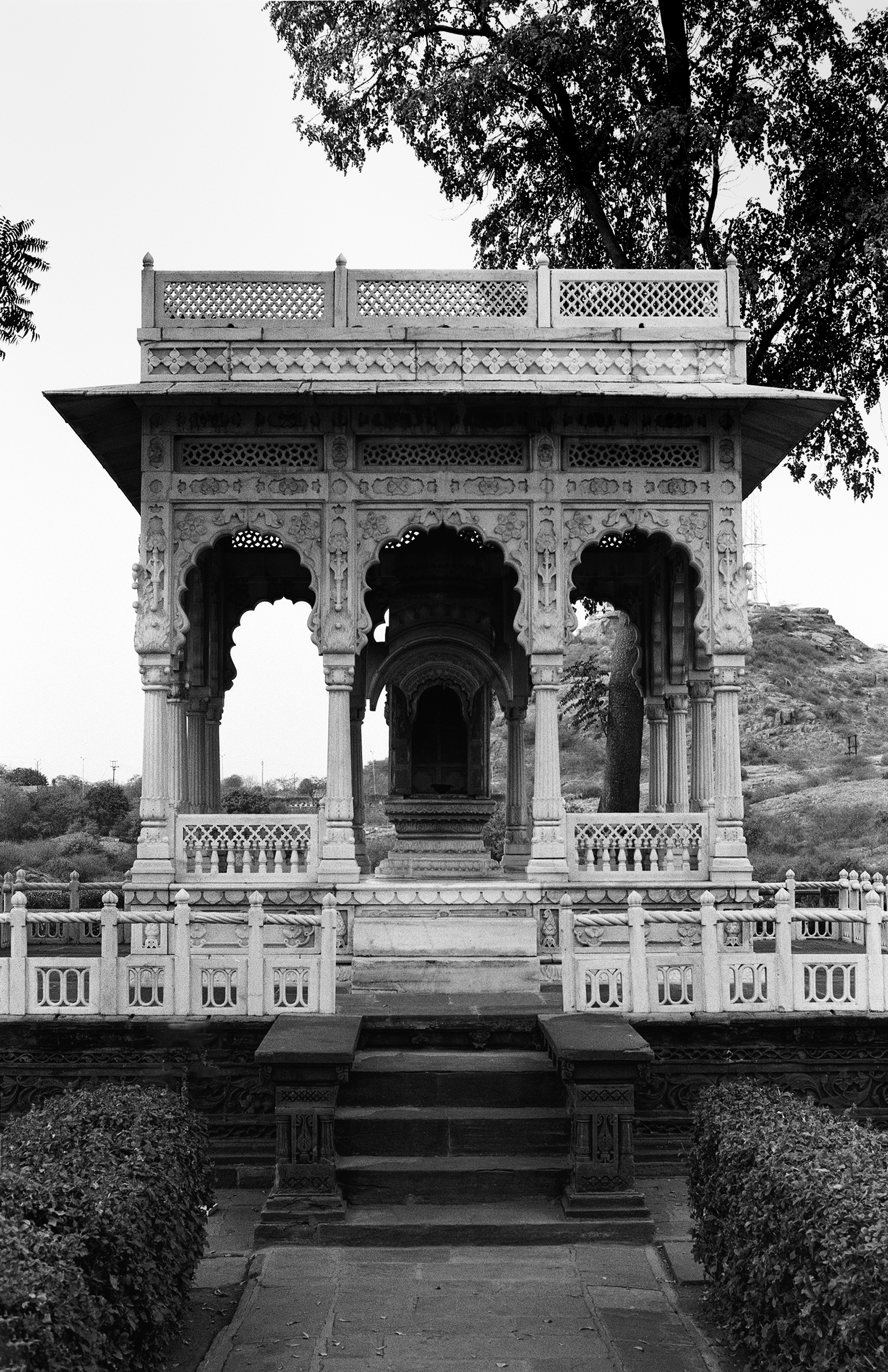 Ornate palace facade with intricate stone carvings and archways
