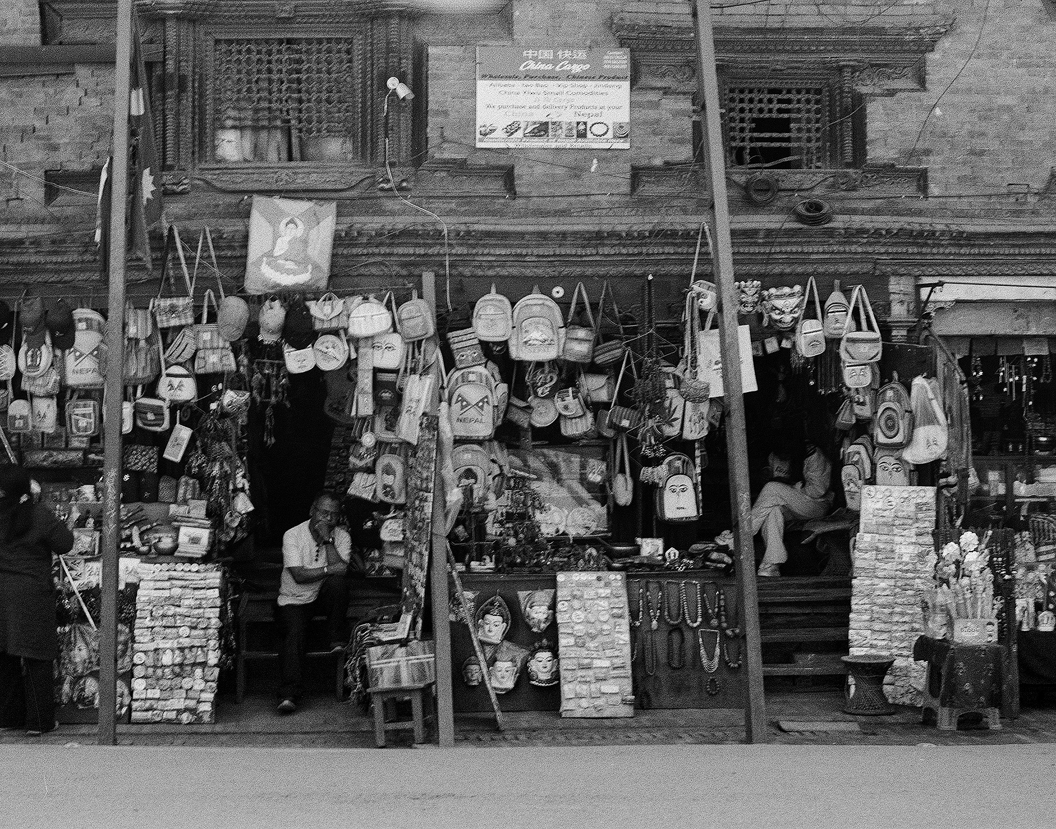 Market stall overflowing with hanging lanterns and traditional crafts and souvenirs