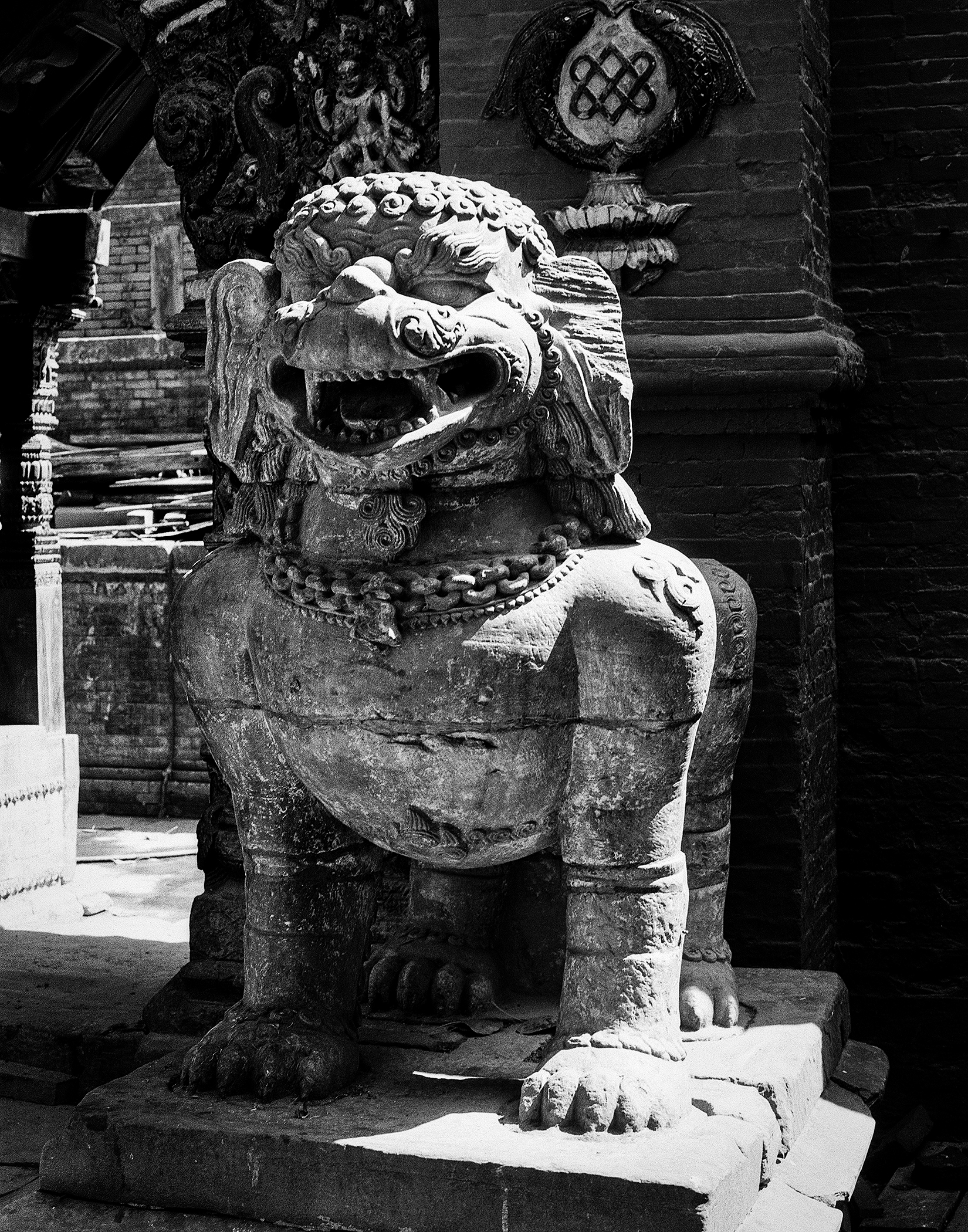 Protective stone lion or guardian deity sculpture with elaborate carved features