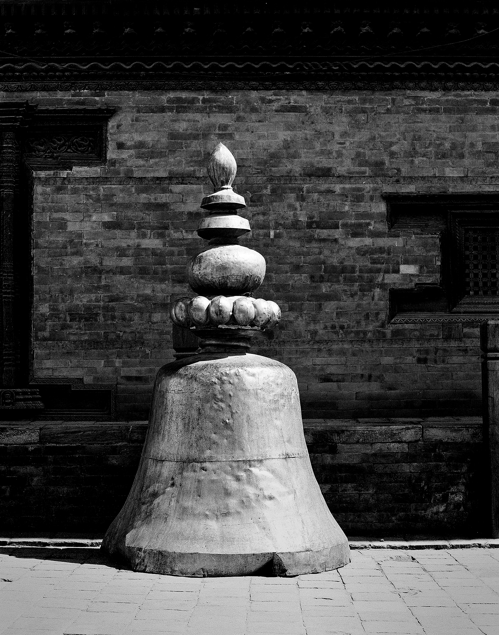 Ornate stone finial or architectural spire ornament on temple structure