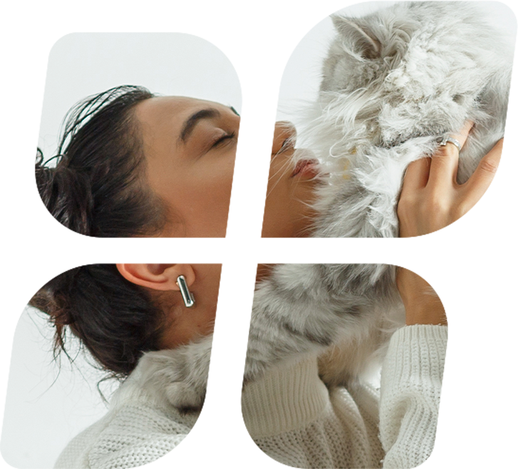 Mujer abrazando a su gato gris