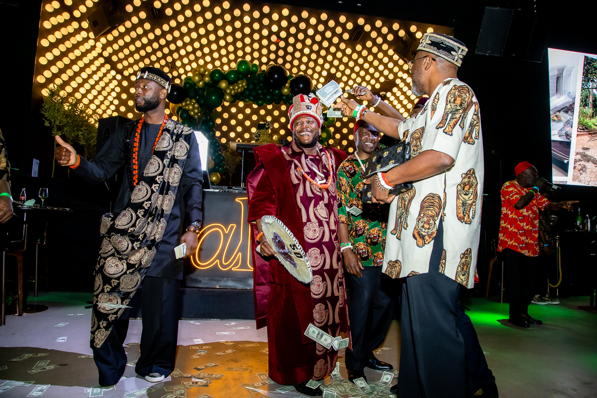 Sam with guests in cultural attire