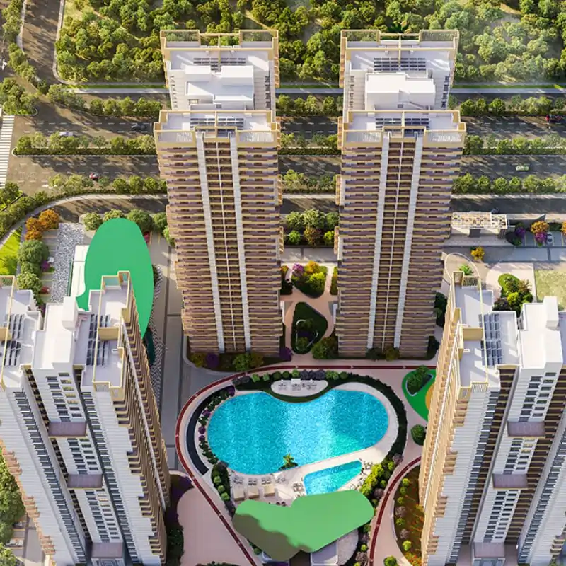 Wave Eden aerial view of twin towers with heart-shaped pool and landscaping