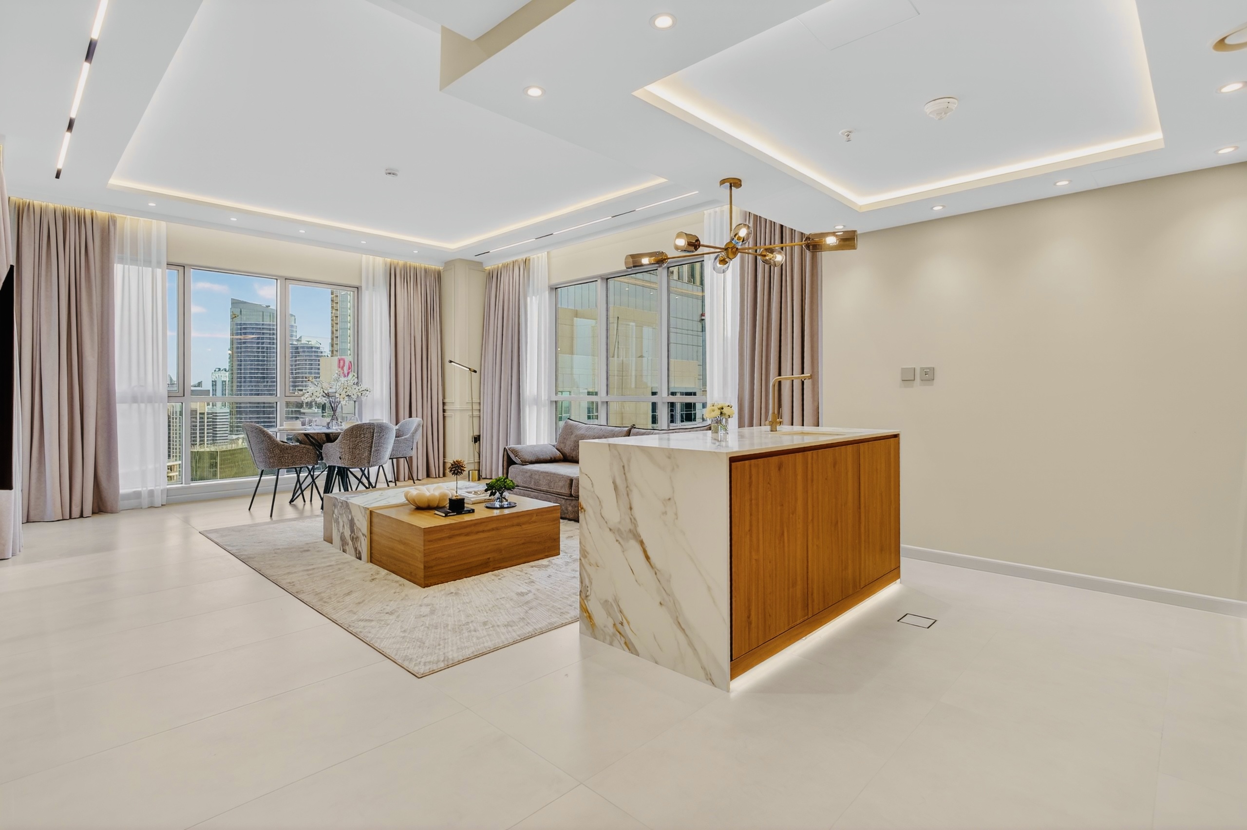 Open living space with marble kitchen island and city views