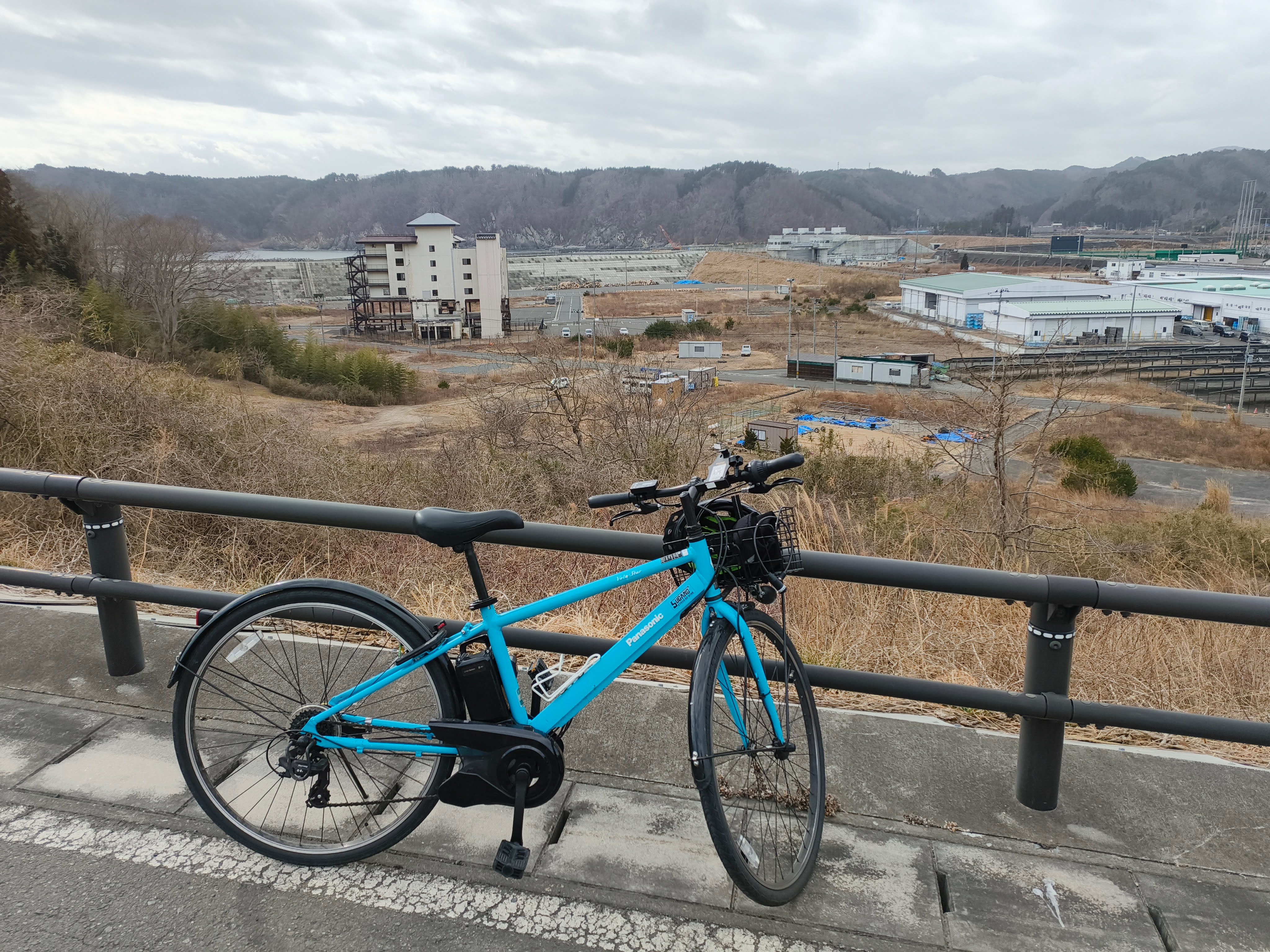 Evacuation riding experience - E-bike overlooking Taro from elevated viewpoint