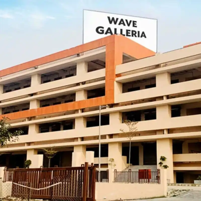 Wave Galleria architectural side view with branding