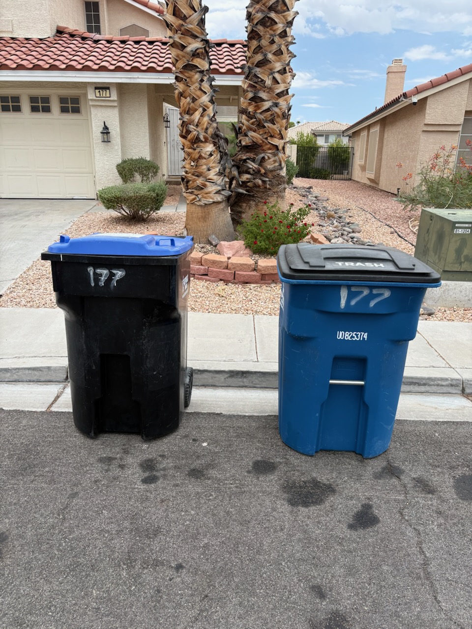 Trash and recycling bins marked for the same Las Vegas rental property