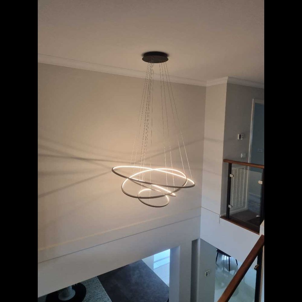 Modern LED ring chandelier in stairwell