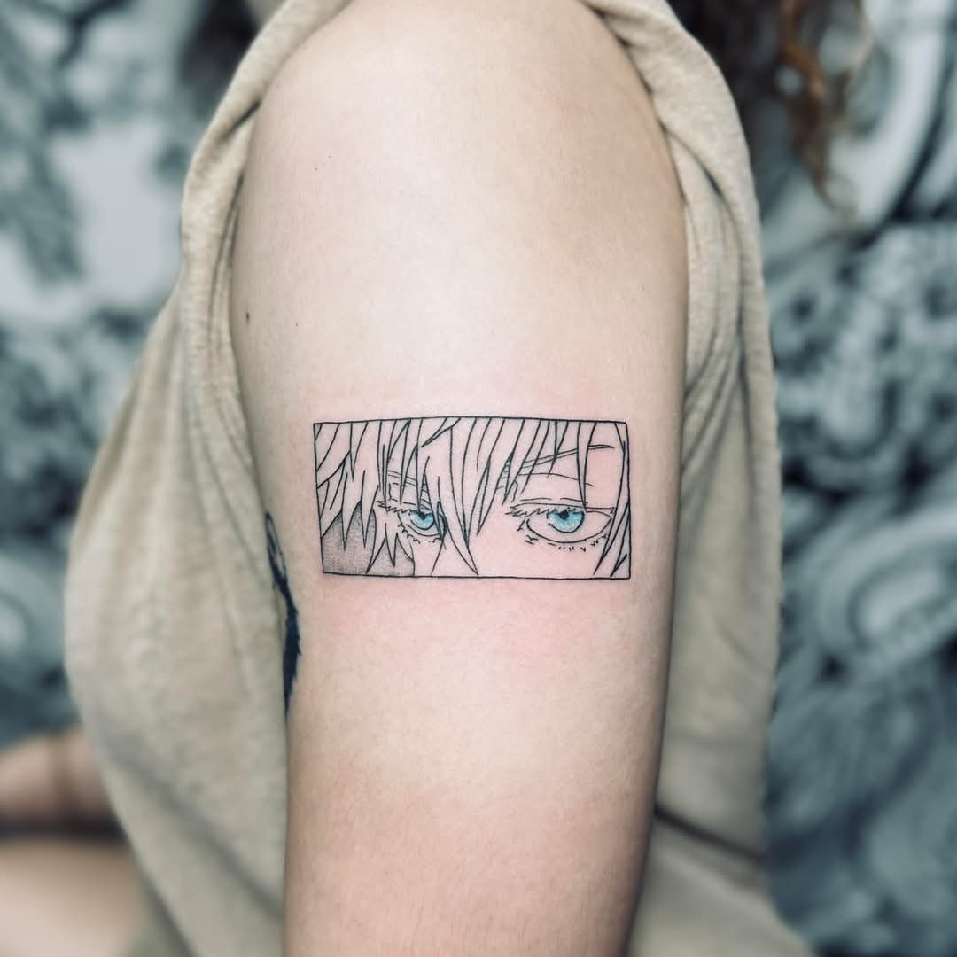 Anime character eyes tattoo with blue highlights