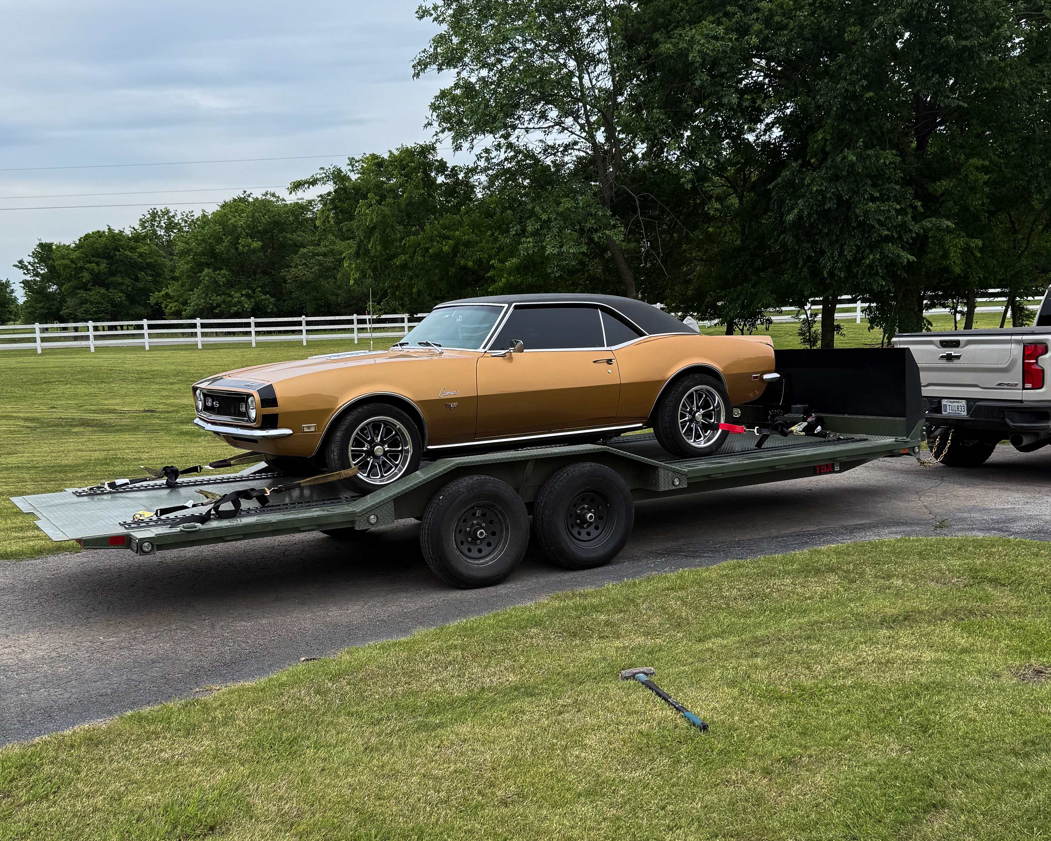 Gold 1968 Chevrolet Camaro SS loaded on the Maxx-D T5X tilt car hauler - Prairie State Rentals Jenks OK