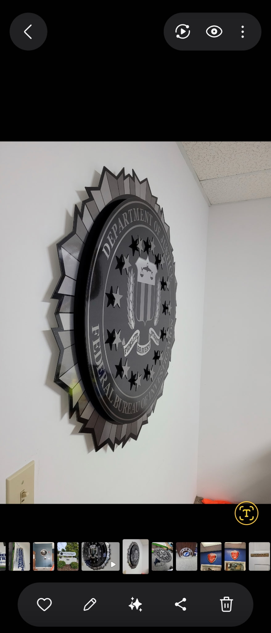 Large Department of Justice FBI seal mounted on wall, gunmetal dimensional medallion sign