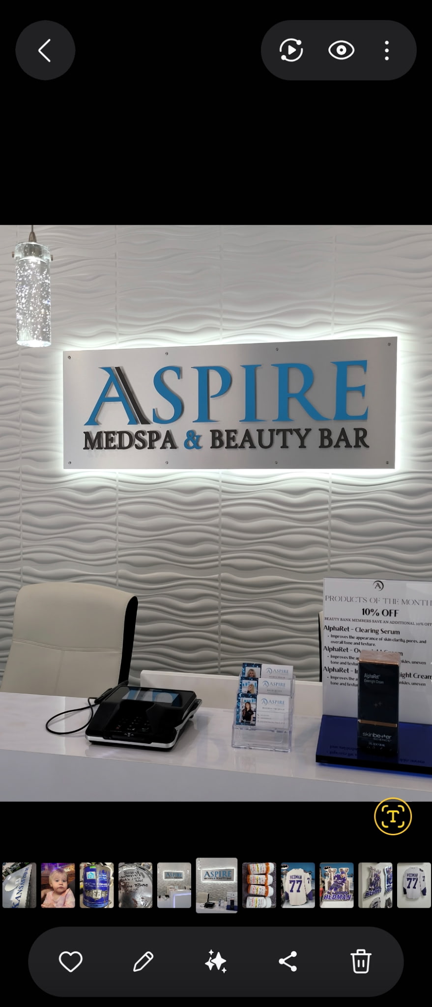 Aspire Medspa halo-lit interior lobby sign with brushed aluminum panel and teal dimensional letters