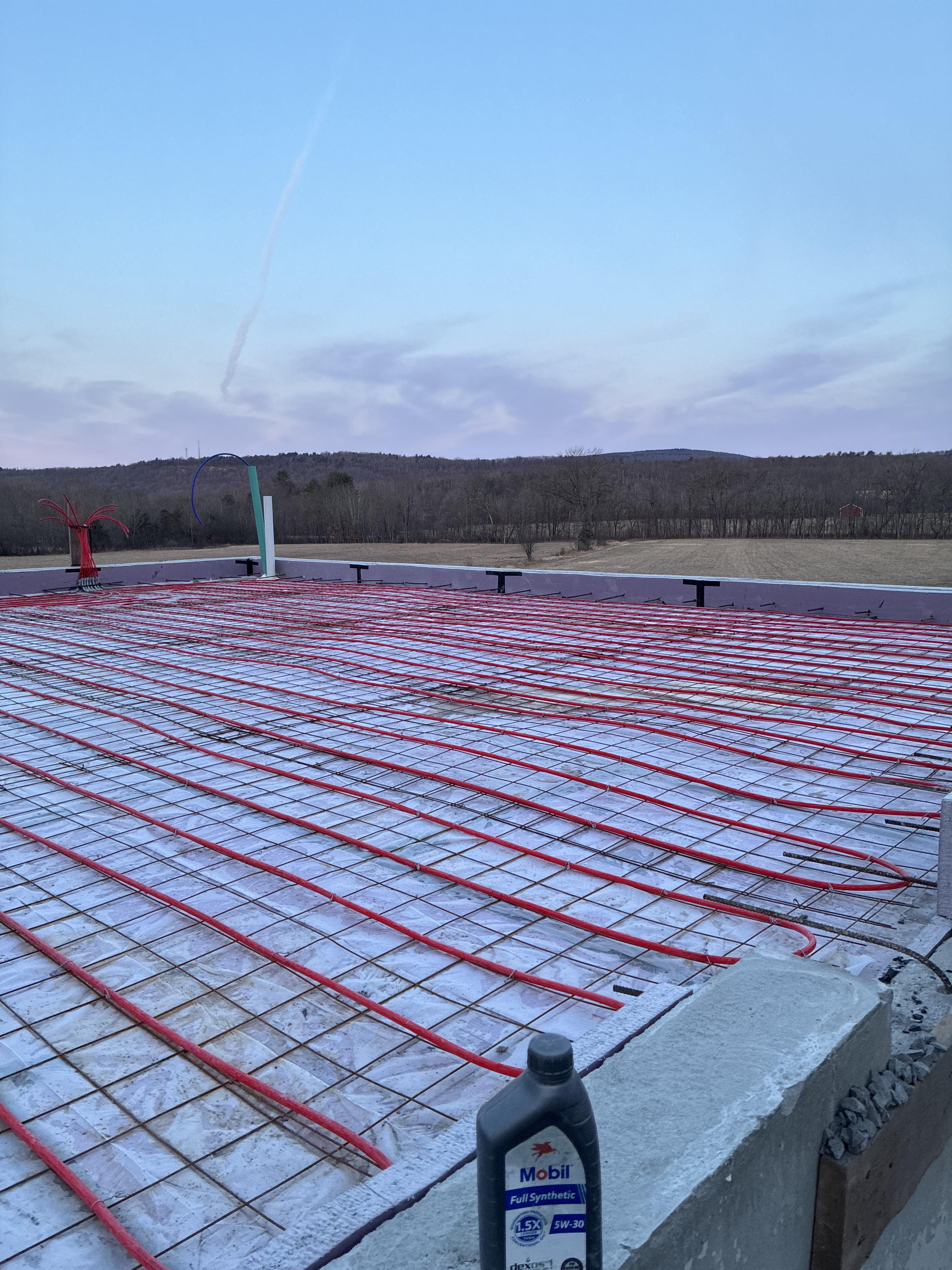 Radiant heat tubing on rebar mesh before concrete pour