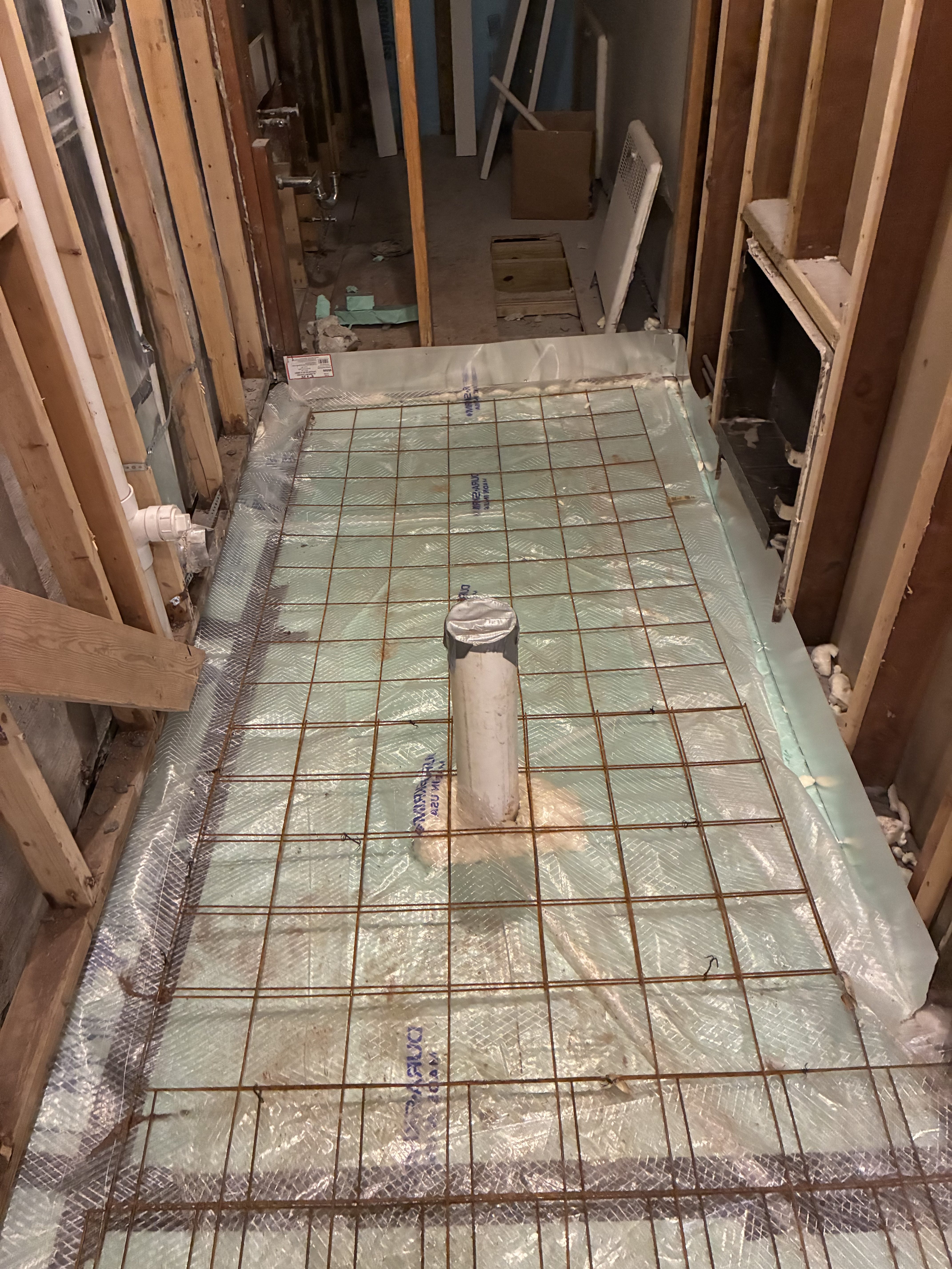 Basement floor prep with plumbing rough-in