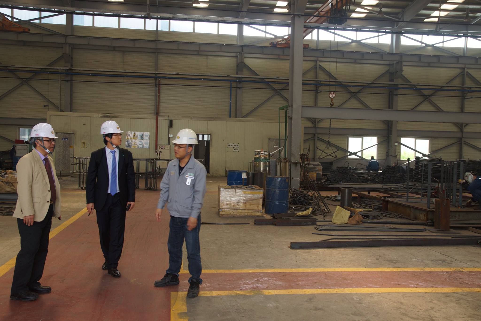 Leadership touring industrial facility