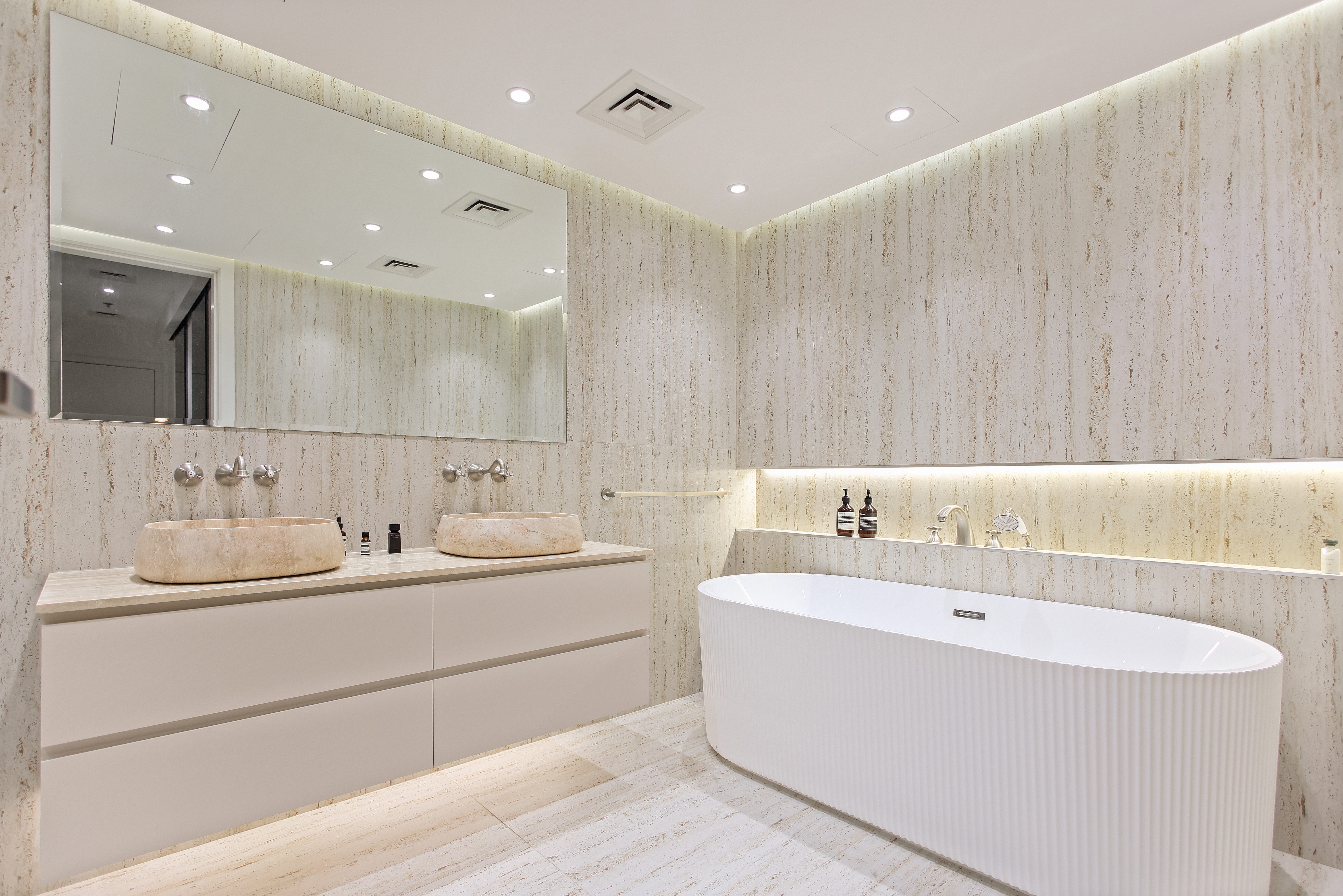 Luxurious bathroom with freestanding fluted bathtub