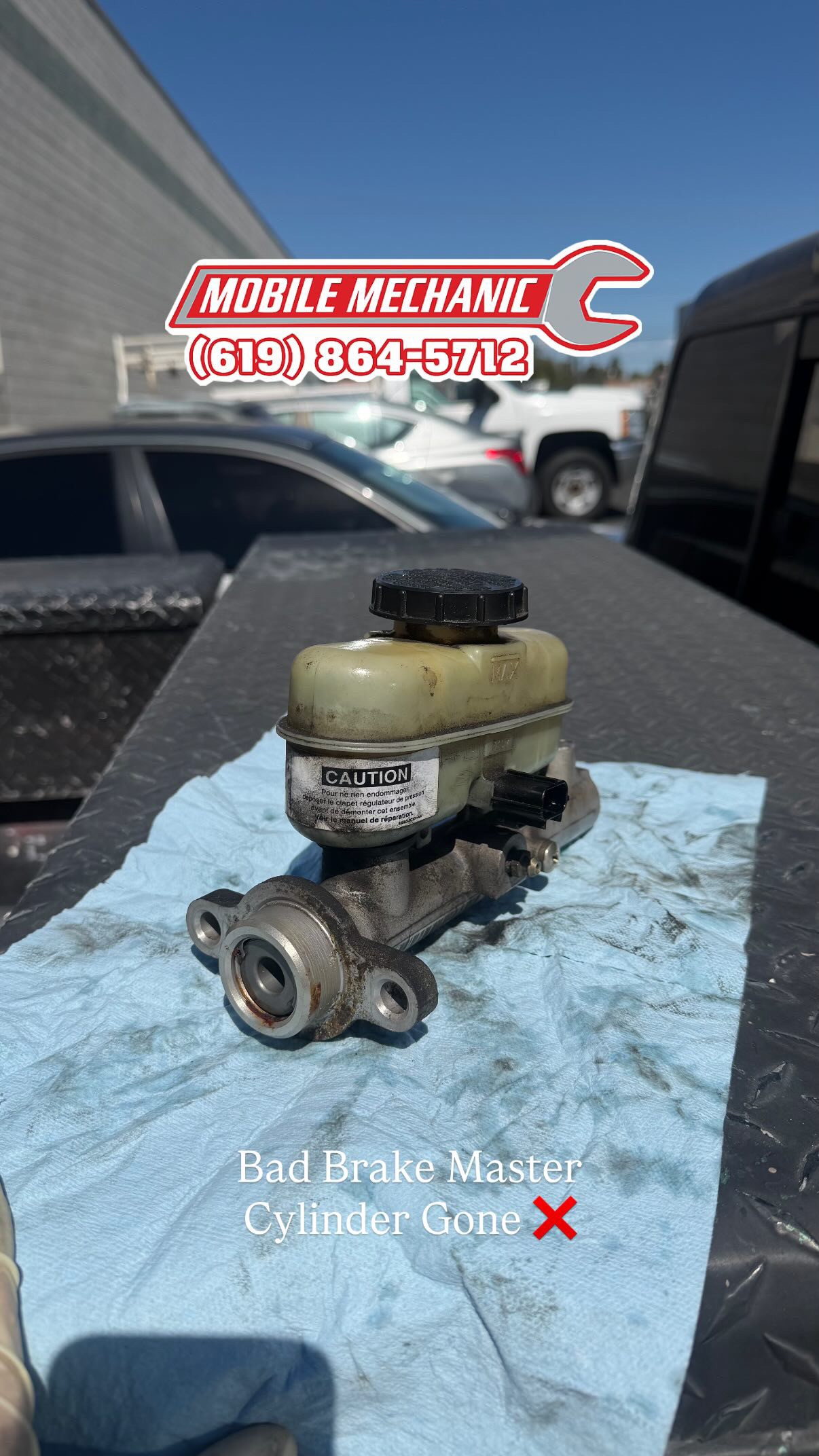 Old failing brake master cylinder removed from vehicle