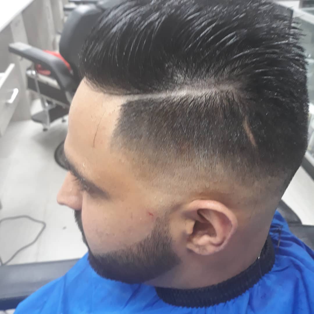Textured quiff with fade and beard