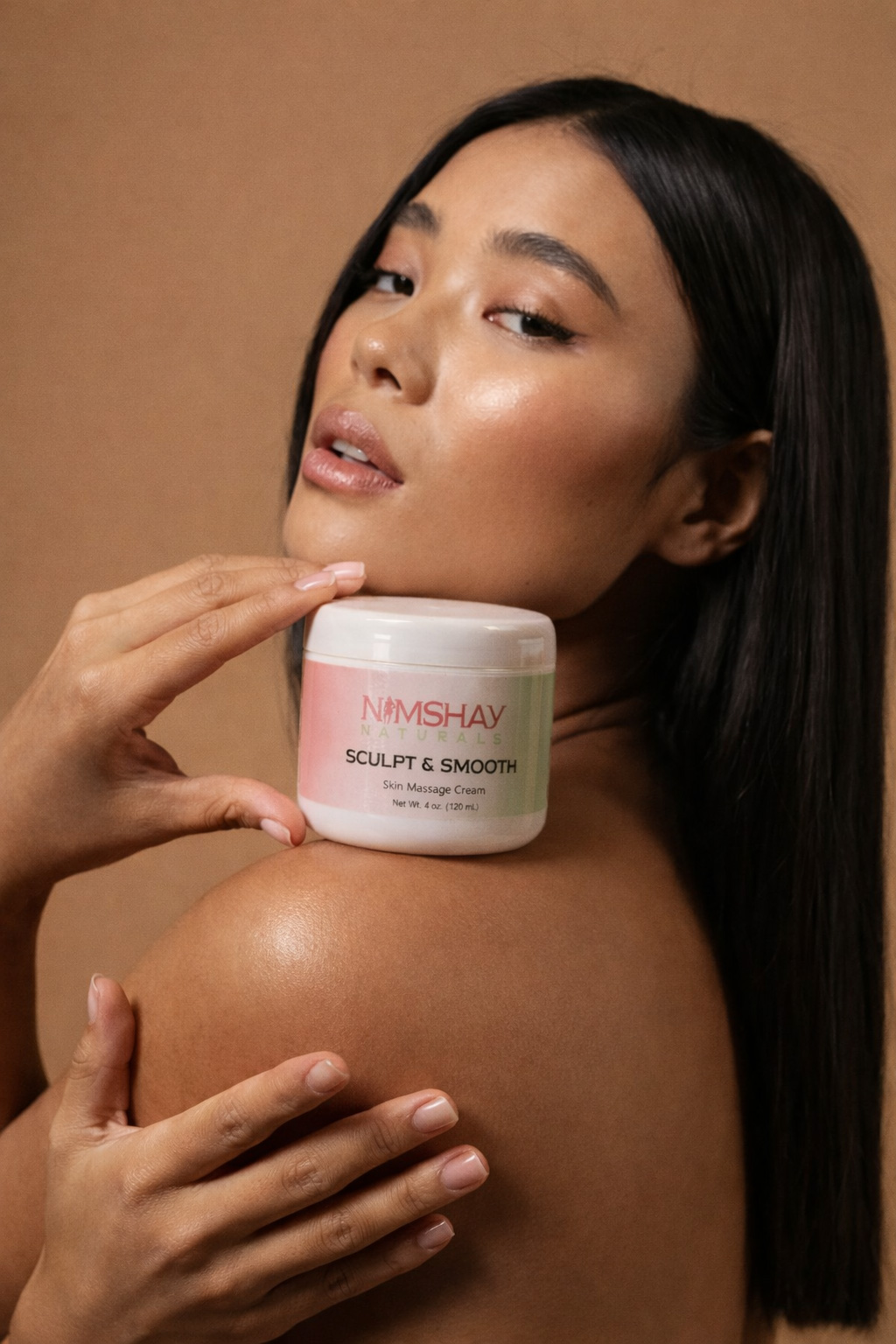 Beauty portrait holding a skincare jar