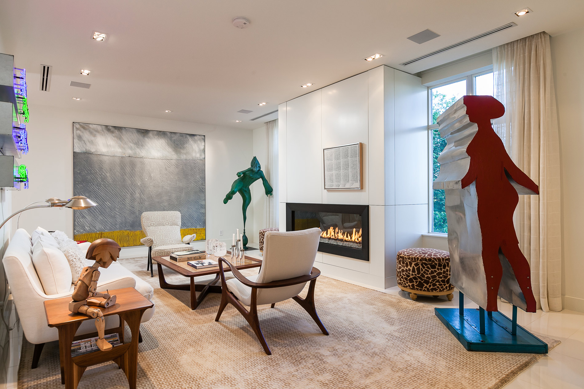 Modern living room with sculptures and fireplace
