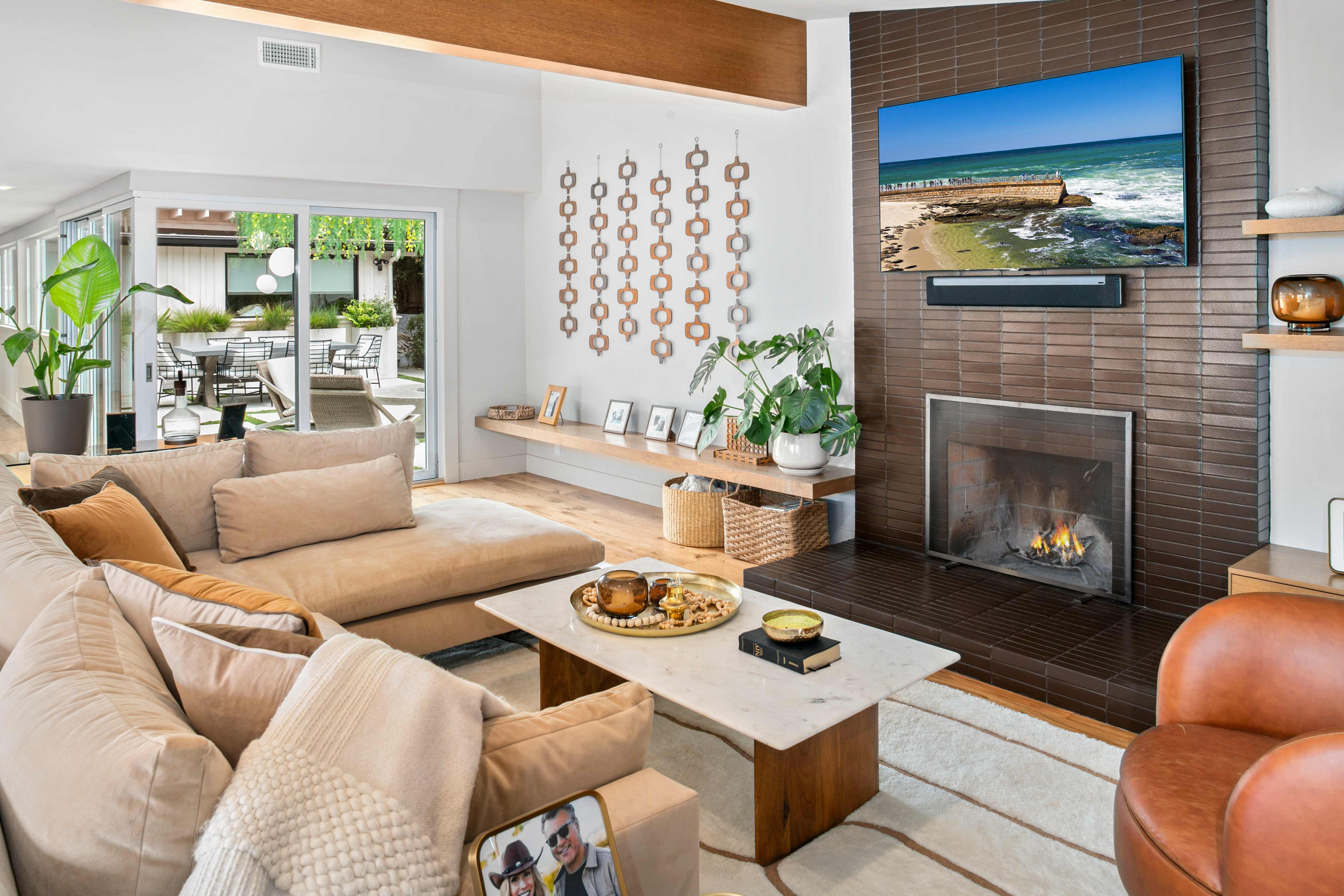 Bright modern living room with fireplace and indoor-outdoor flow