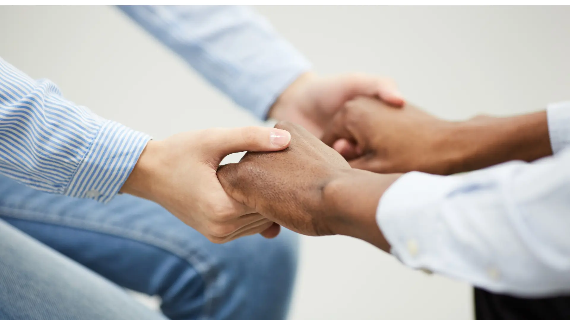 Hands held together supportively