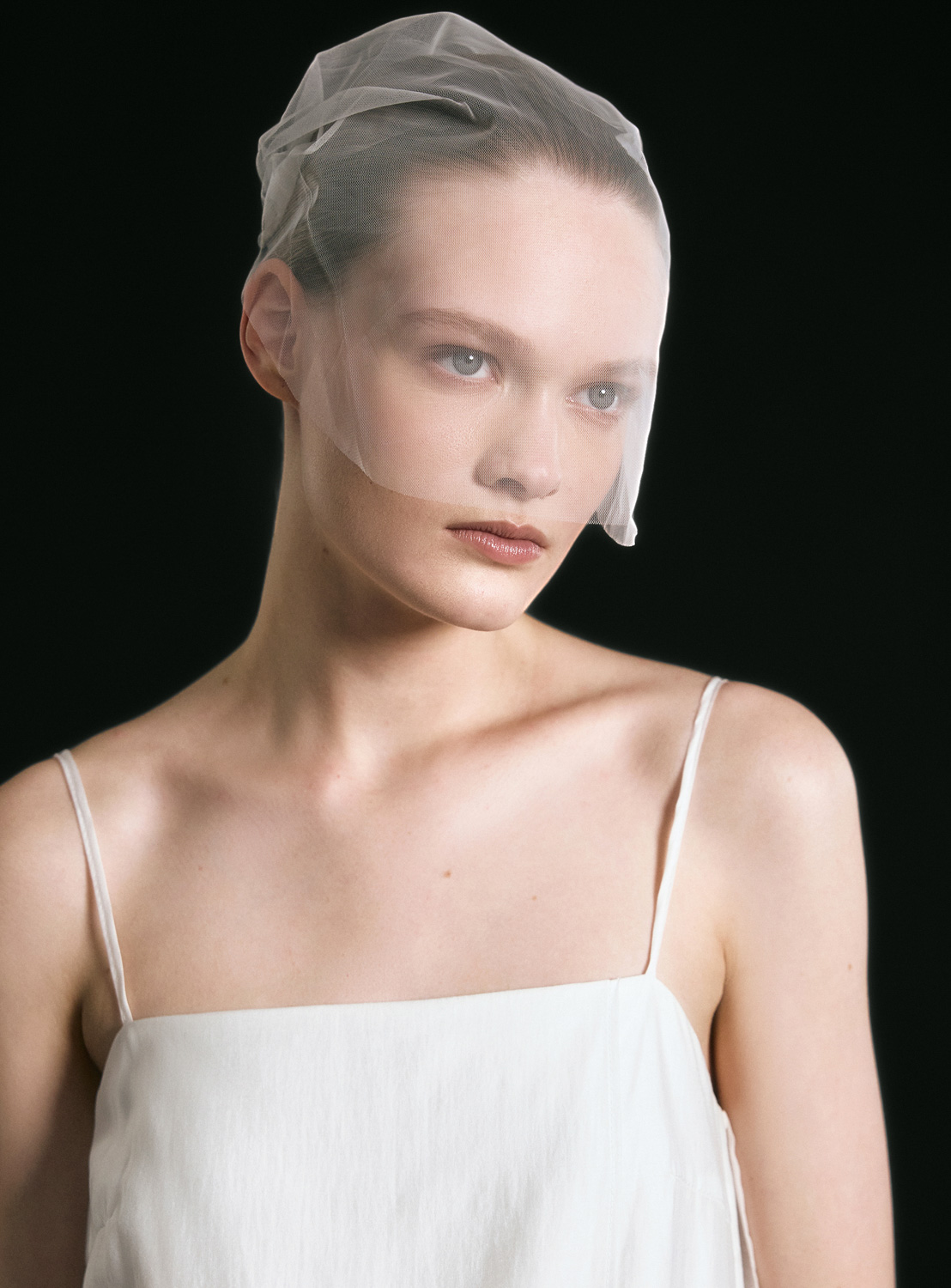 Gate31 Editorial — white minimalist styling, black background, artistic portraits