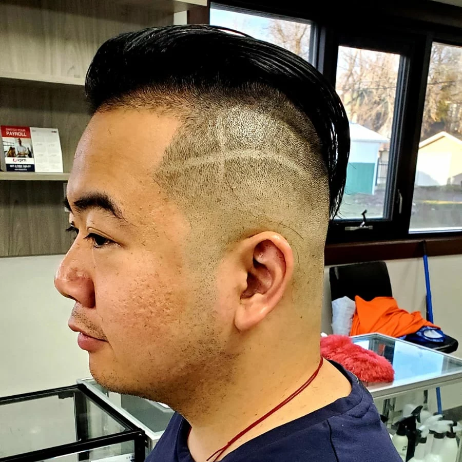 Slicked back cut with hair design