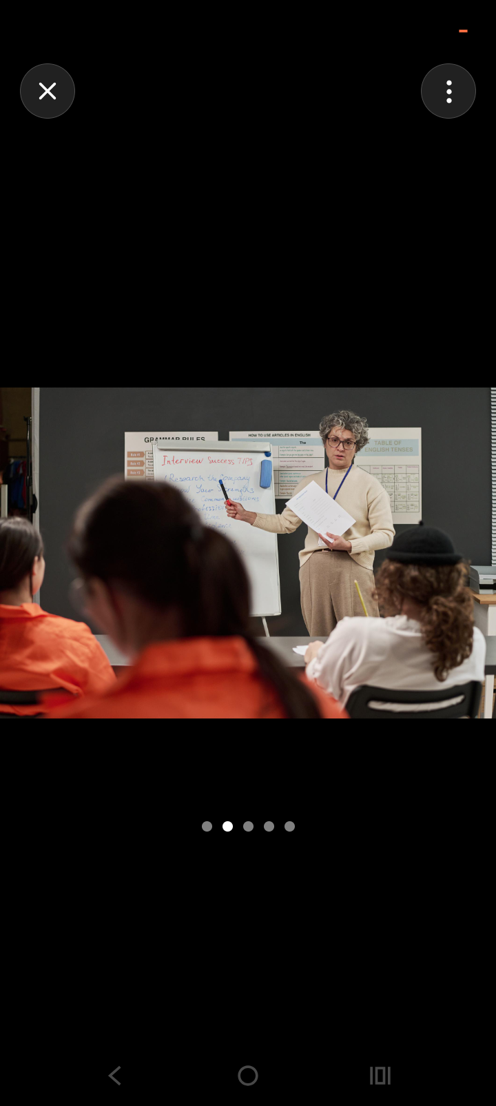 Instructor teaching interview skills to students in an educational program