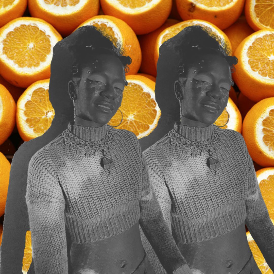 Grayscale double figure on vivid orange citrus background