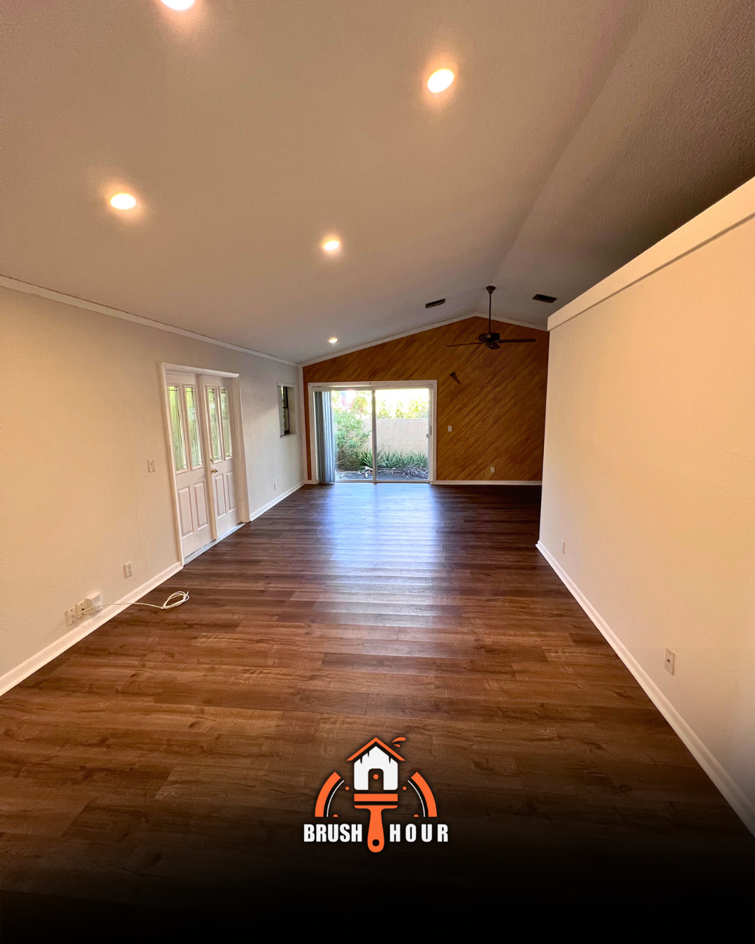 Living room with wood floor and recessed lighting