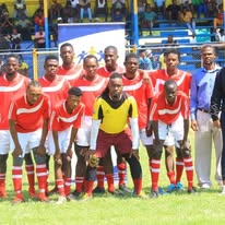 Liberator FC team in red jerseys at stadium