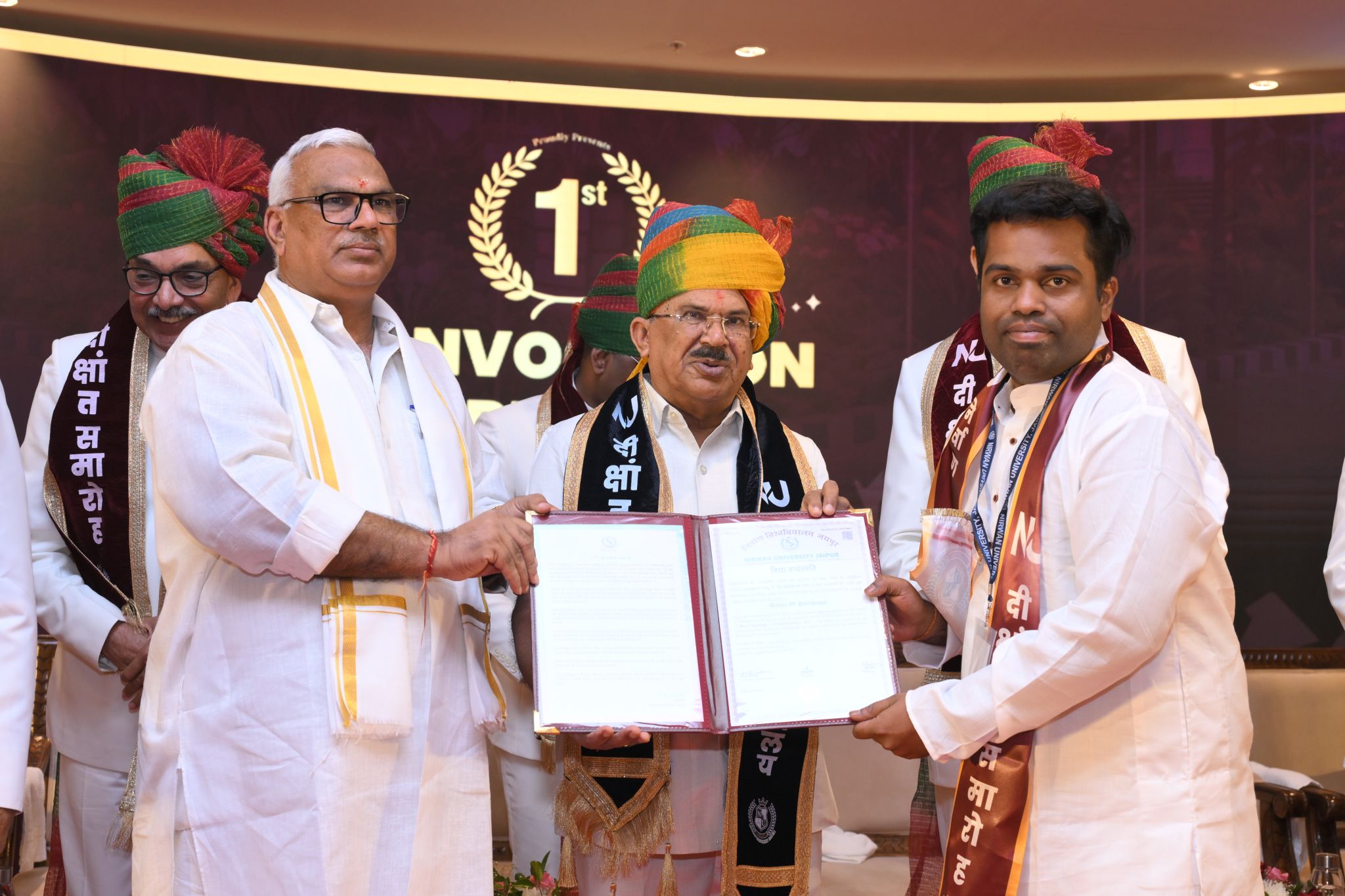 Dr. Umeshkumar KU receiving an honorary degree in ceremonial robe and turban at Nirwan University Jaipur's 1st Convocation