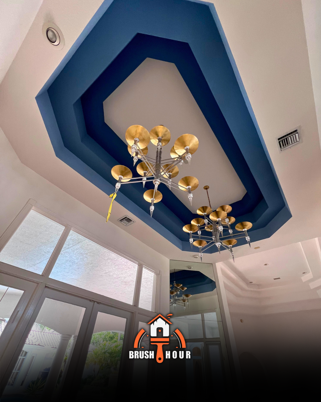 Blue hexagonal ceiling design with chandelier
